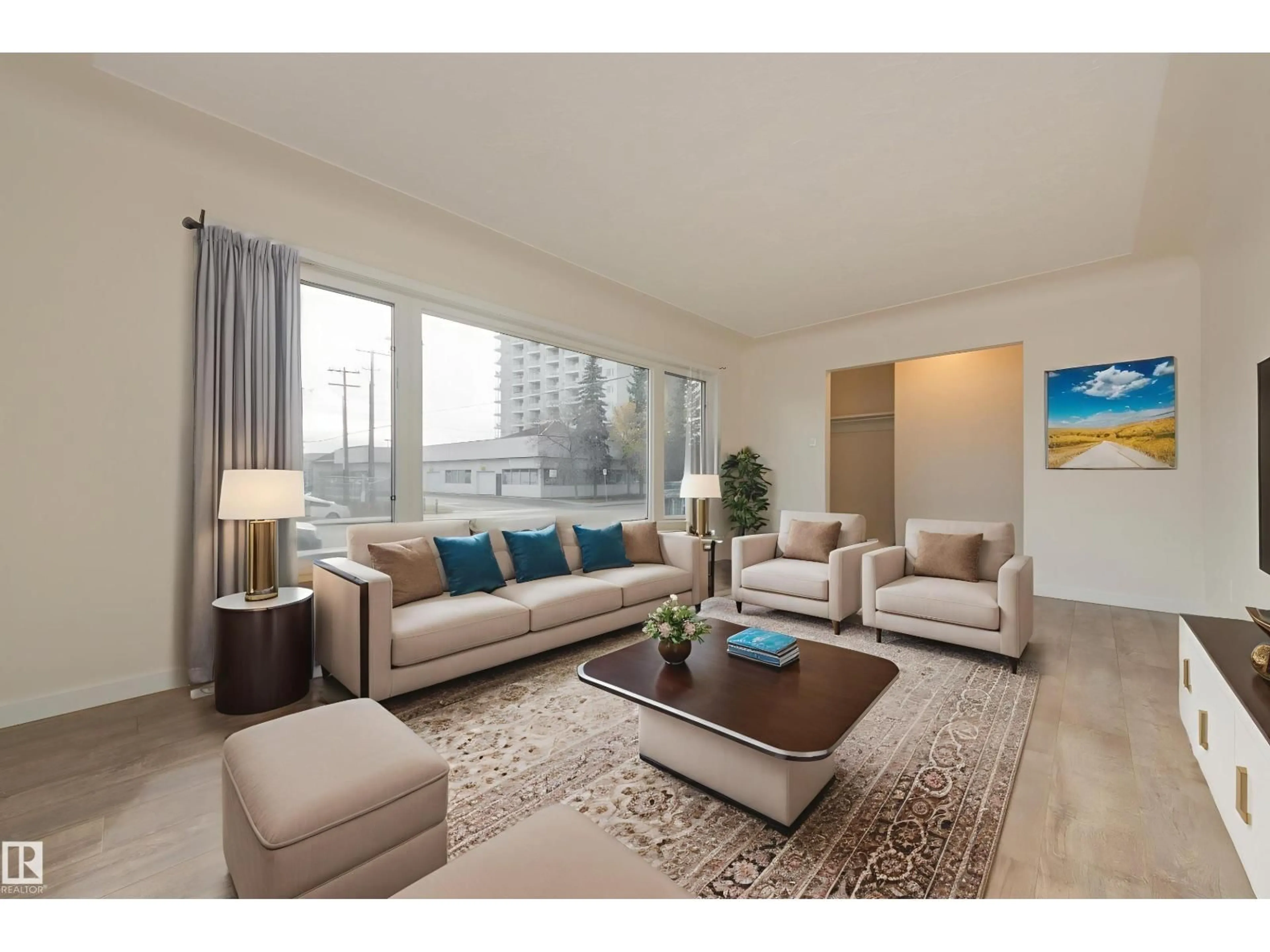 Living room with furniture, wood/laminate floor for 13236 115 AV, Edmonton Alberta T5M3A6