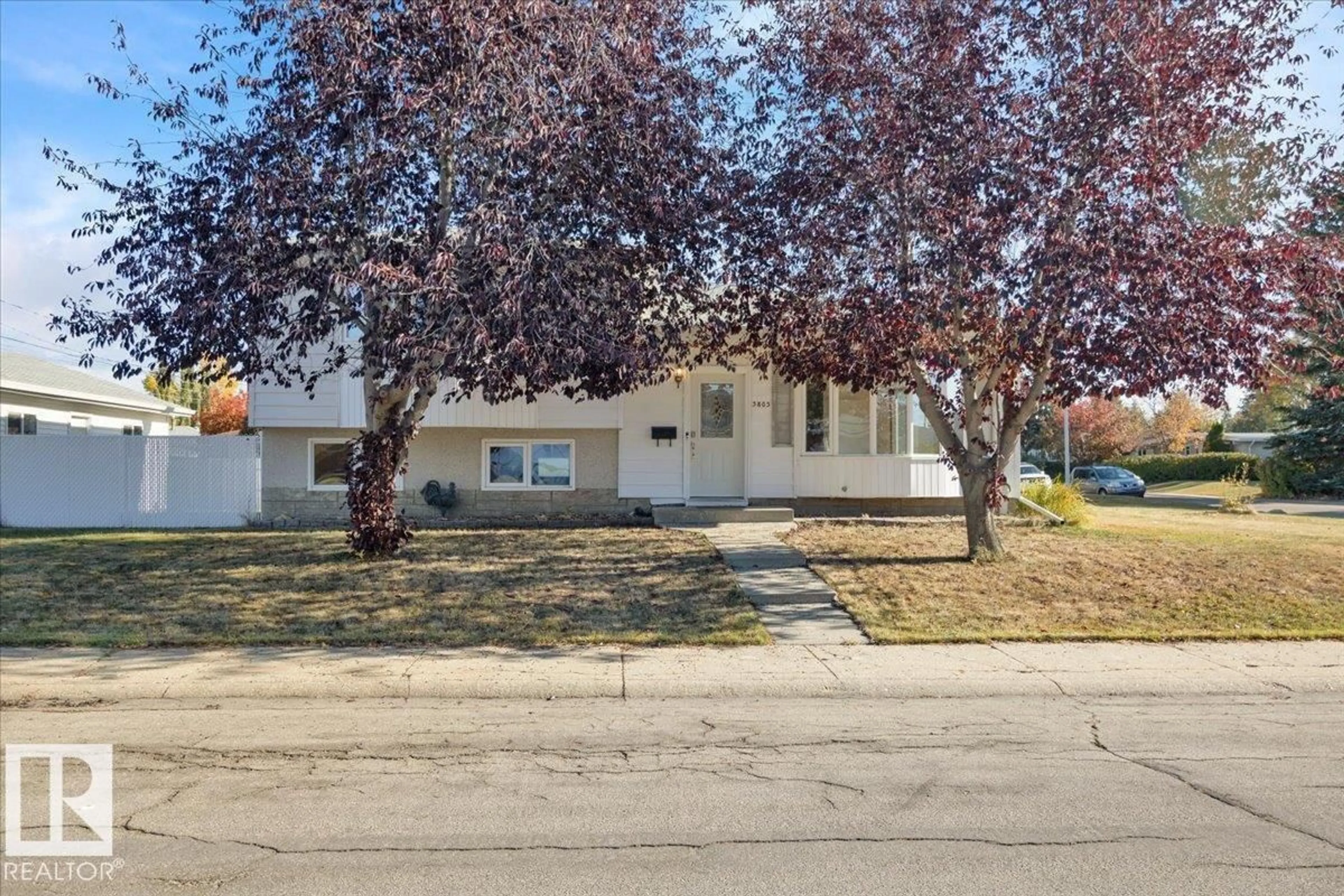 Home with vinyl exterior material, street for NW - 3803 112 ST, Edmonton Alberta T6J1J1