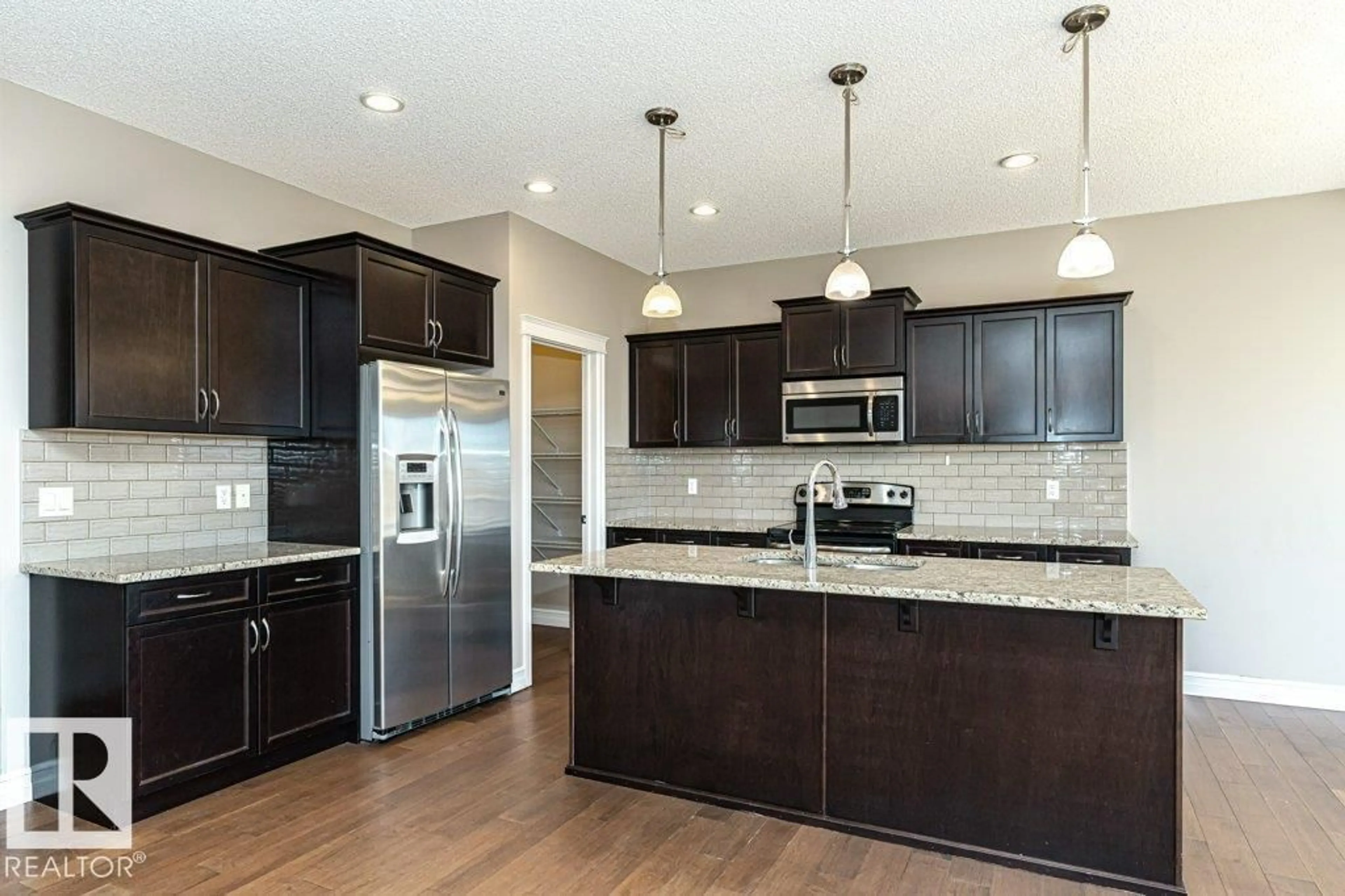 Open concept kitchen, unknown for NW - 1920 33B ST, Edmonton Alberta T6T0L3
