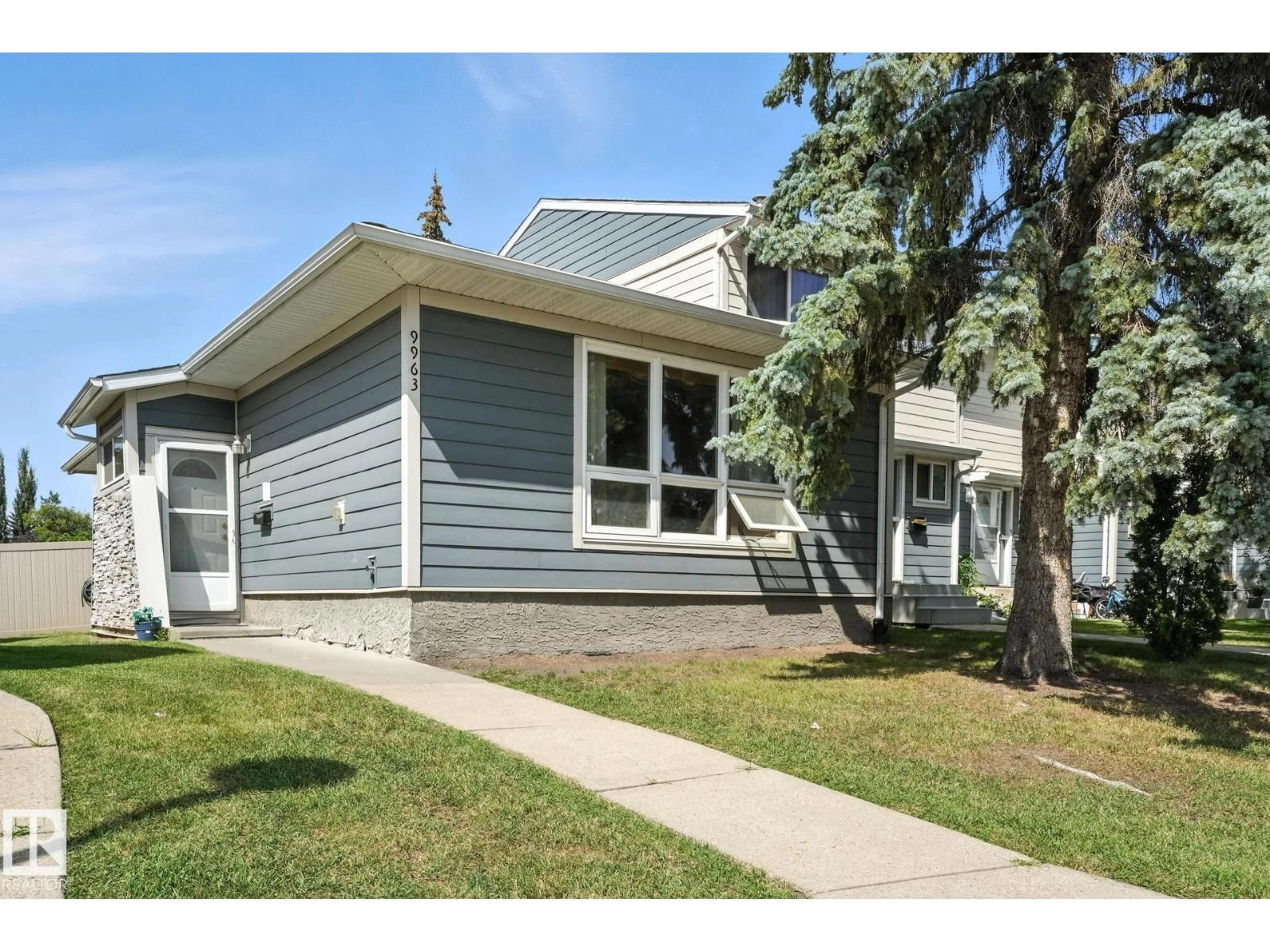 Home with vinyl exterior material, street for NW - 9963 171 AVE, Edmonton Alberta T5X4X2