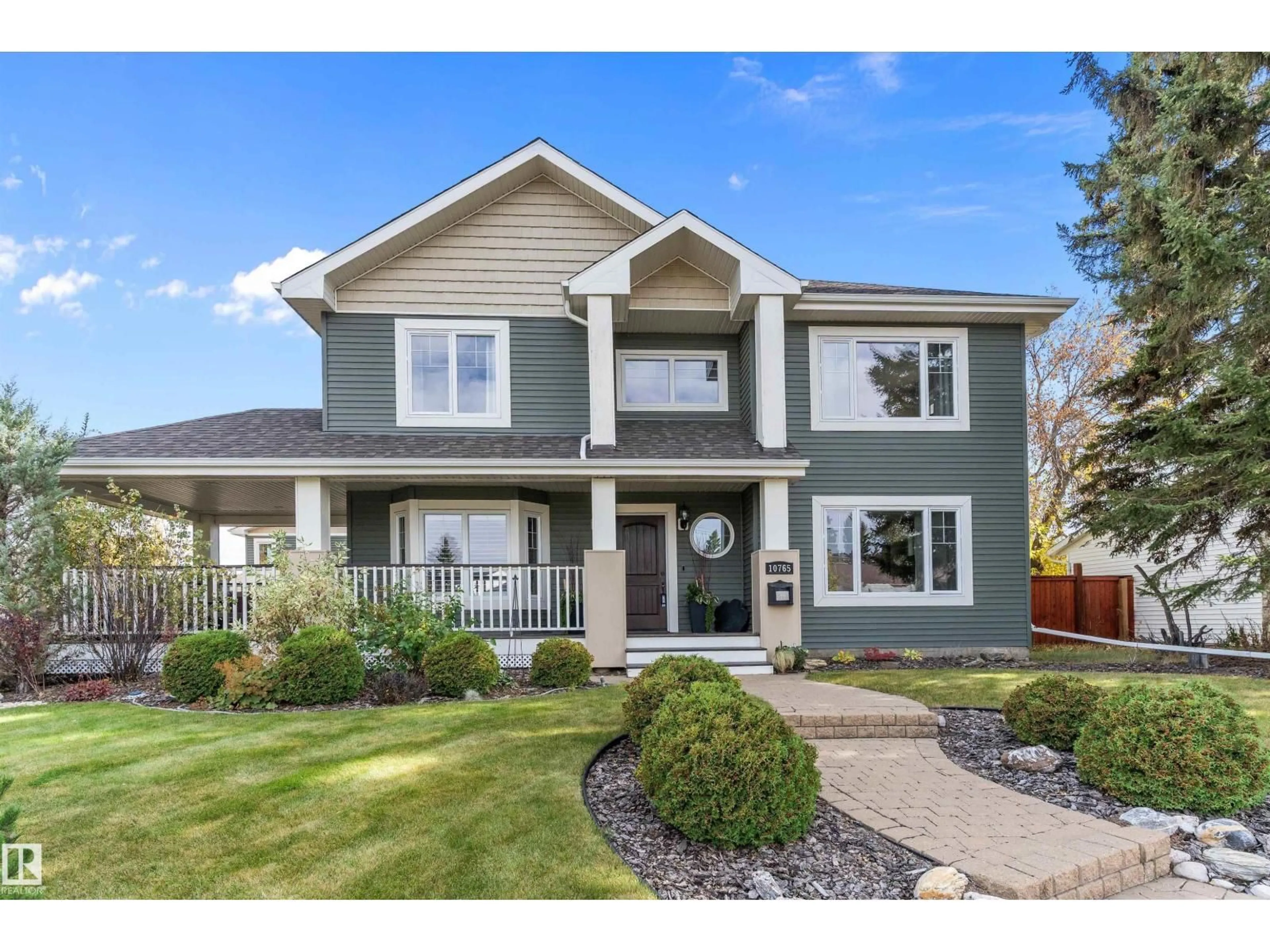 Home with vinyl exterior material, street for NW - 10765 65 ST, Edmonton Alberta T6A2P3