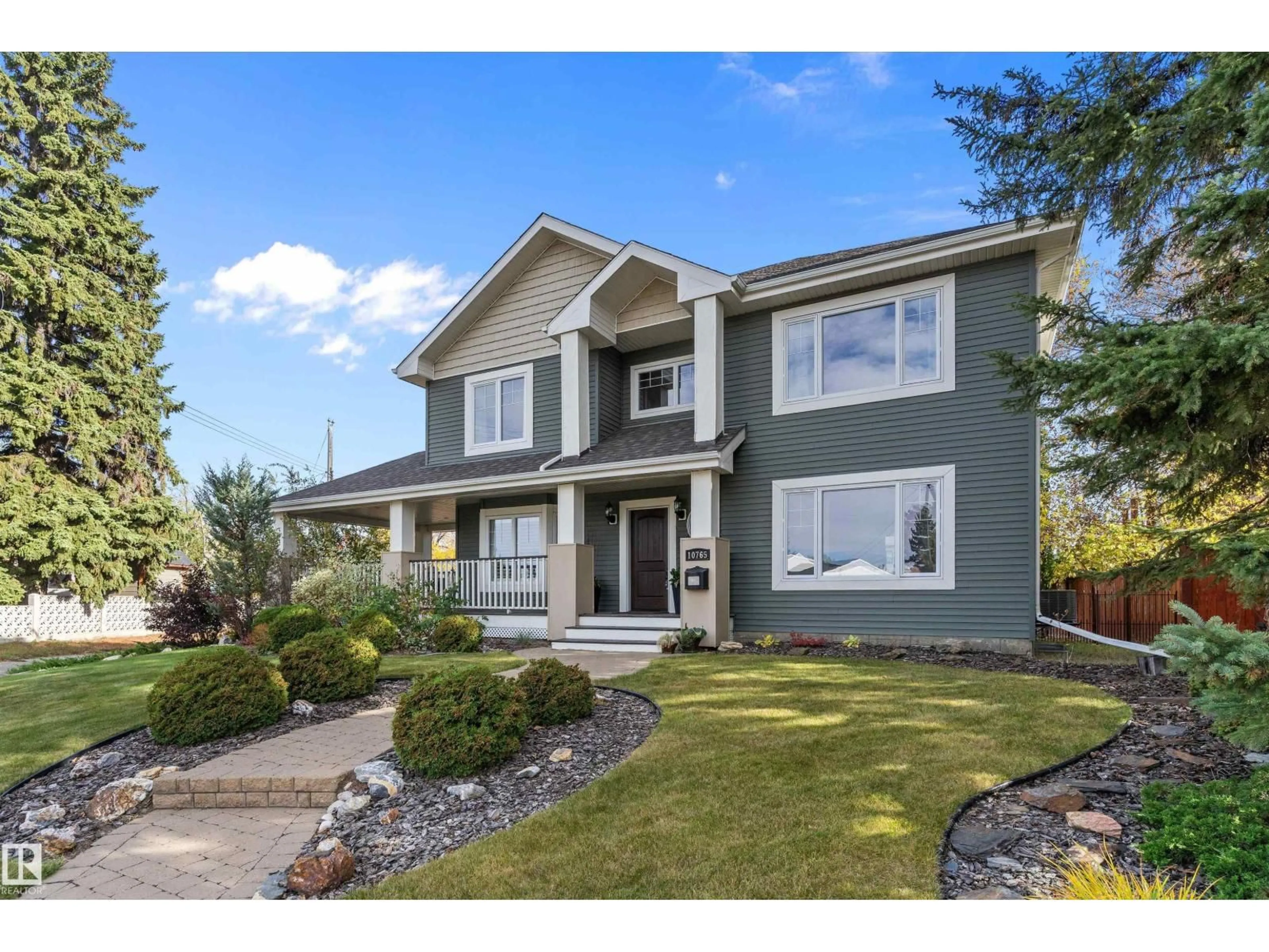 Home with vinyl exterior material, street for NW - 10765 65 ST, Edmonton Alberta T6A2P3