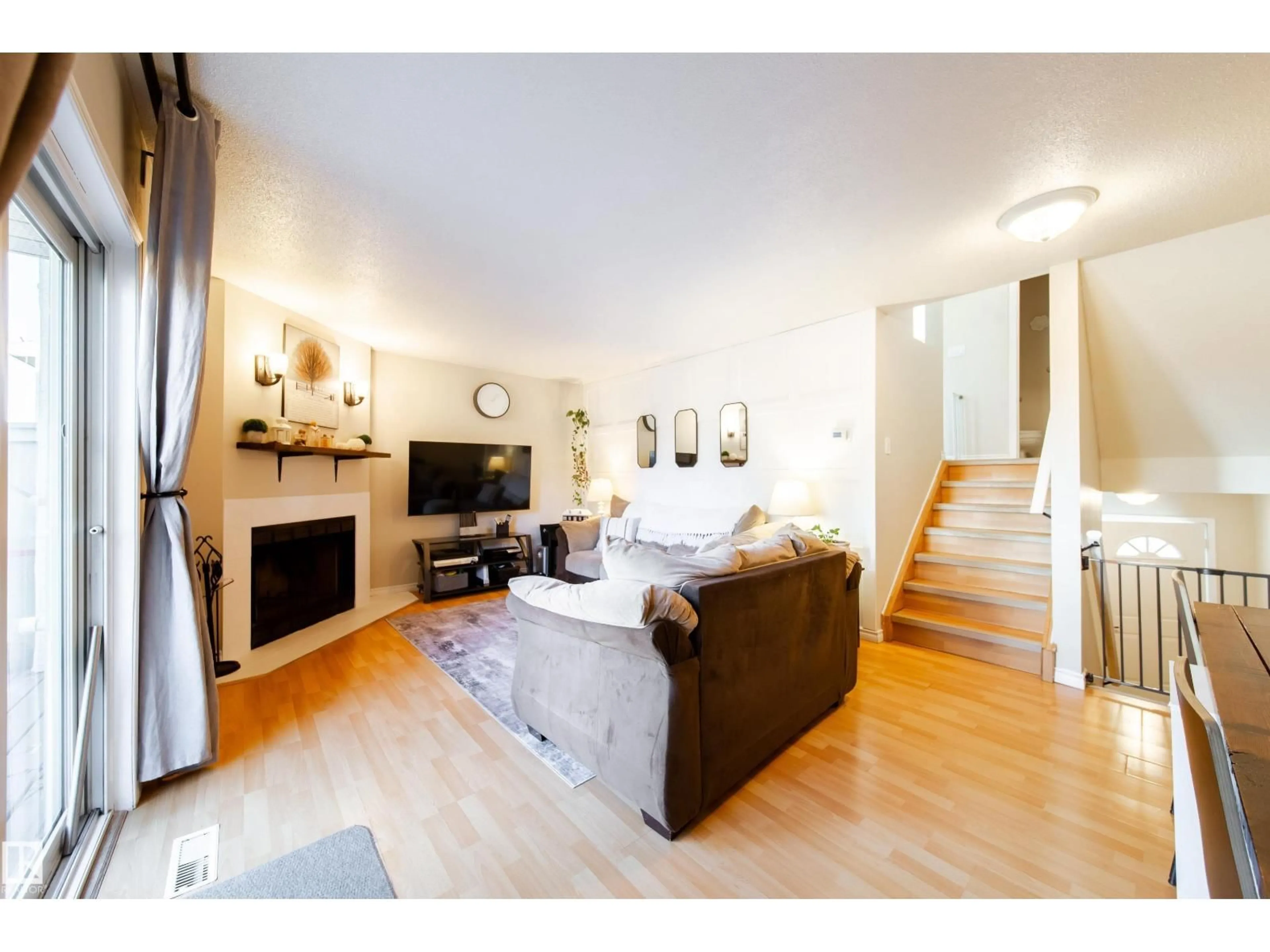Living room with furniture, wood/laminate floor for #26 - 9505 176 ST, Edmonton Alberta T5T5Z4