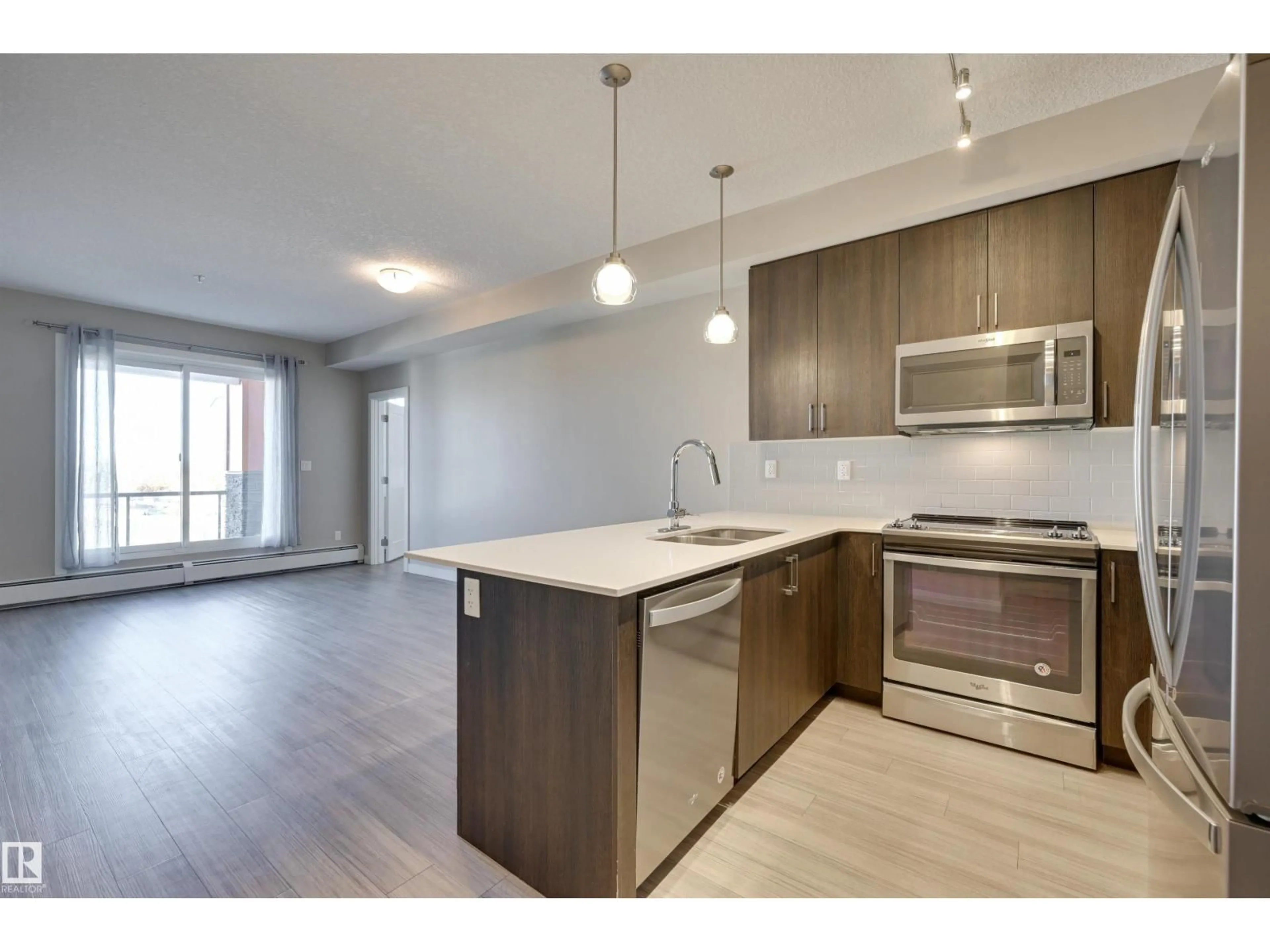 Open concept kitchen, wood/laminate floor for #301 - 301 COLUMBIA AVENUE, Devon Alberta T9G1Y7