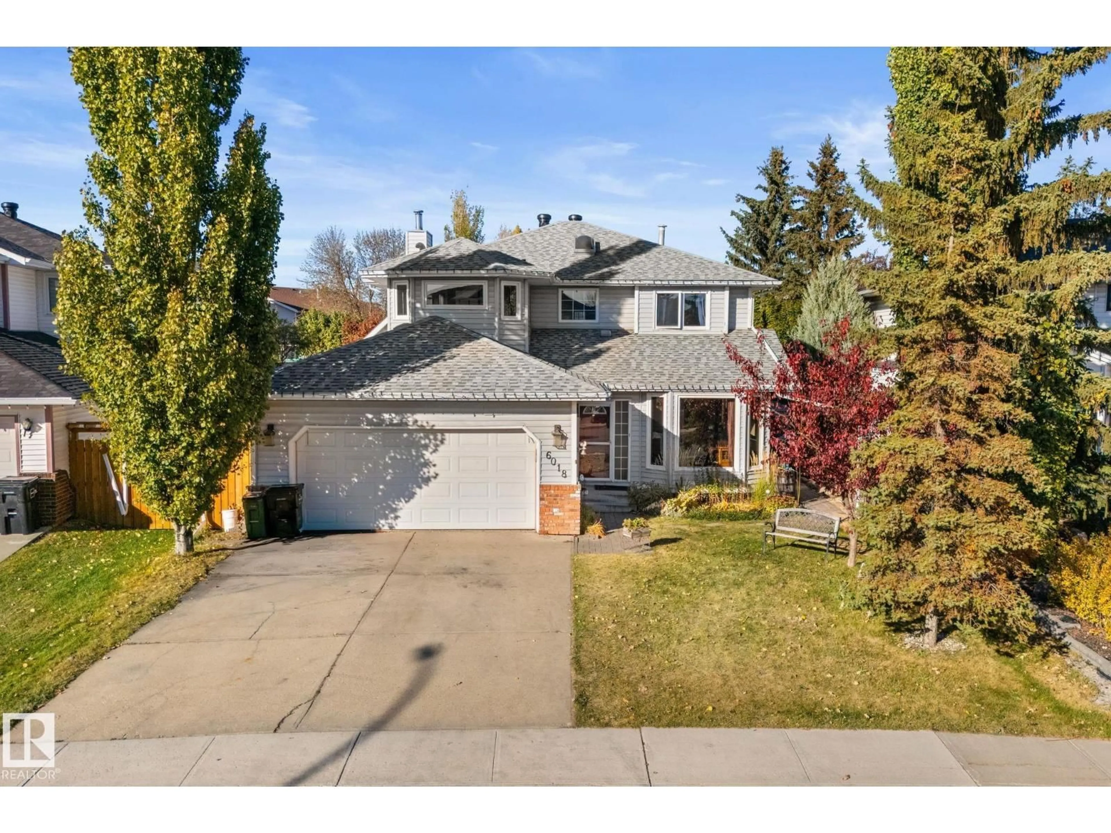 Home with vinyl exterior material, street for 6018 156 AV, Edmonton Alberta T5Y2M8