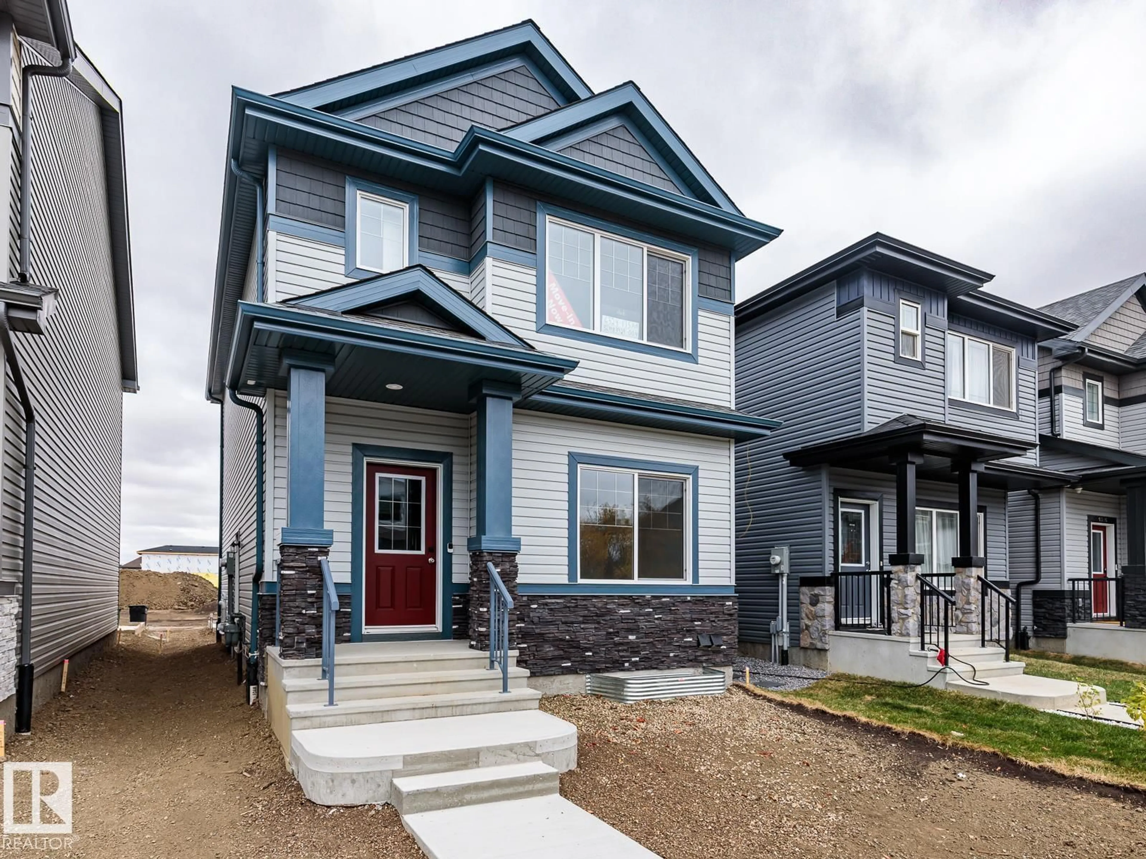 Home with vinyl exterior material, street for 6324 175 AV, Edmonton Alberta T5Y4H2