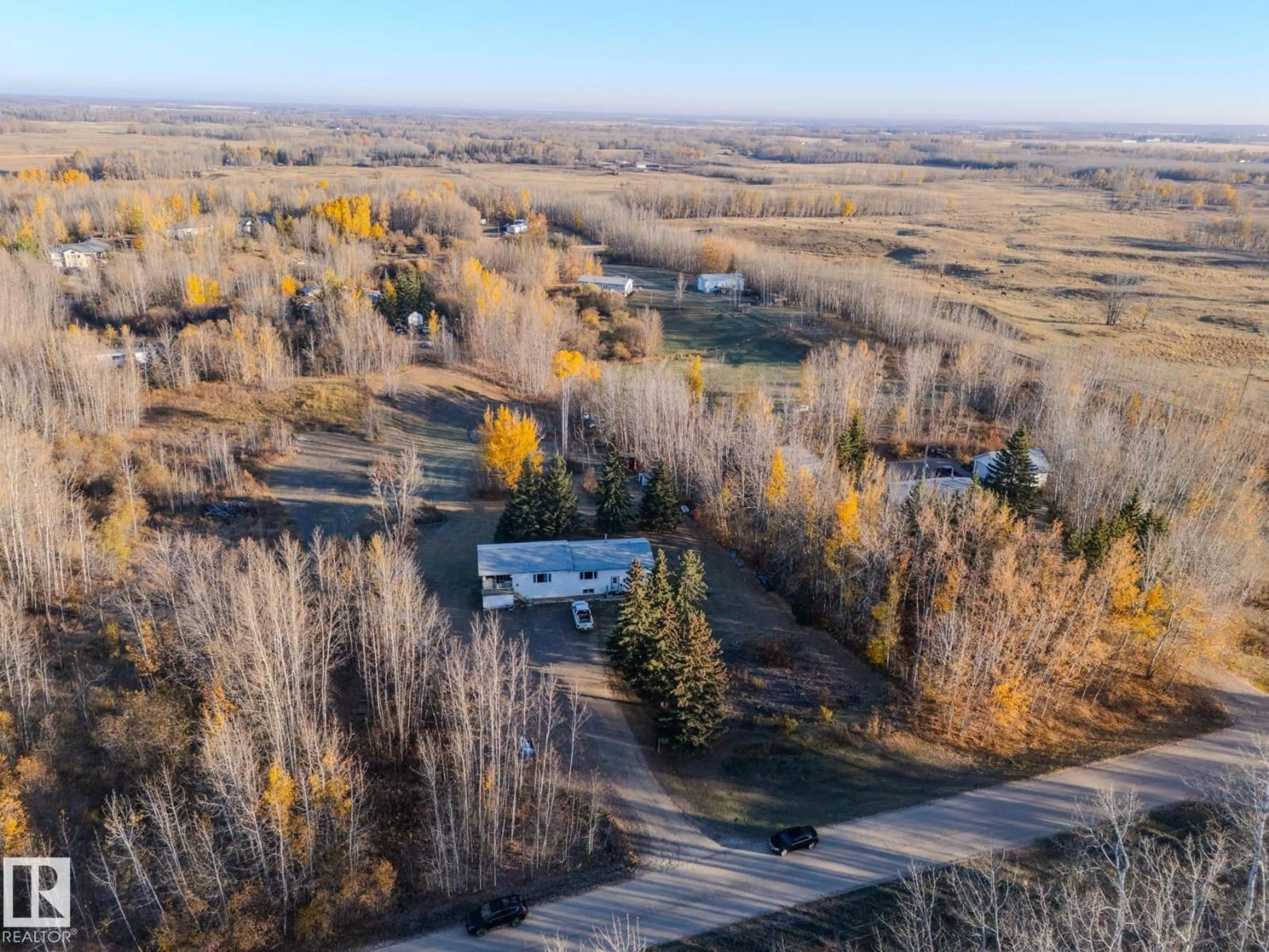 A pic from outside/outdoor area/front of a property/back of a property/a pic from drone, forest/trees view for #4 - 54222 RGE ROAD 25, Rural Lac Ste. Anne County Alberta T0E0A0