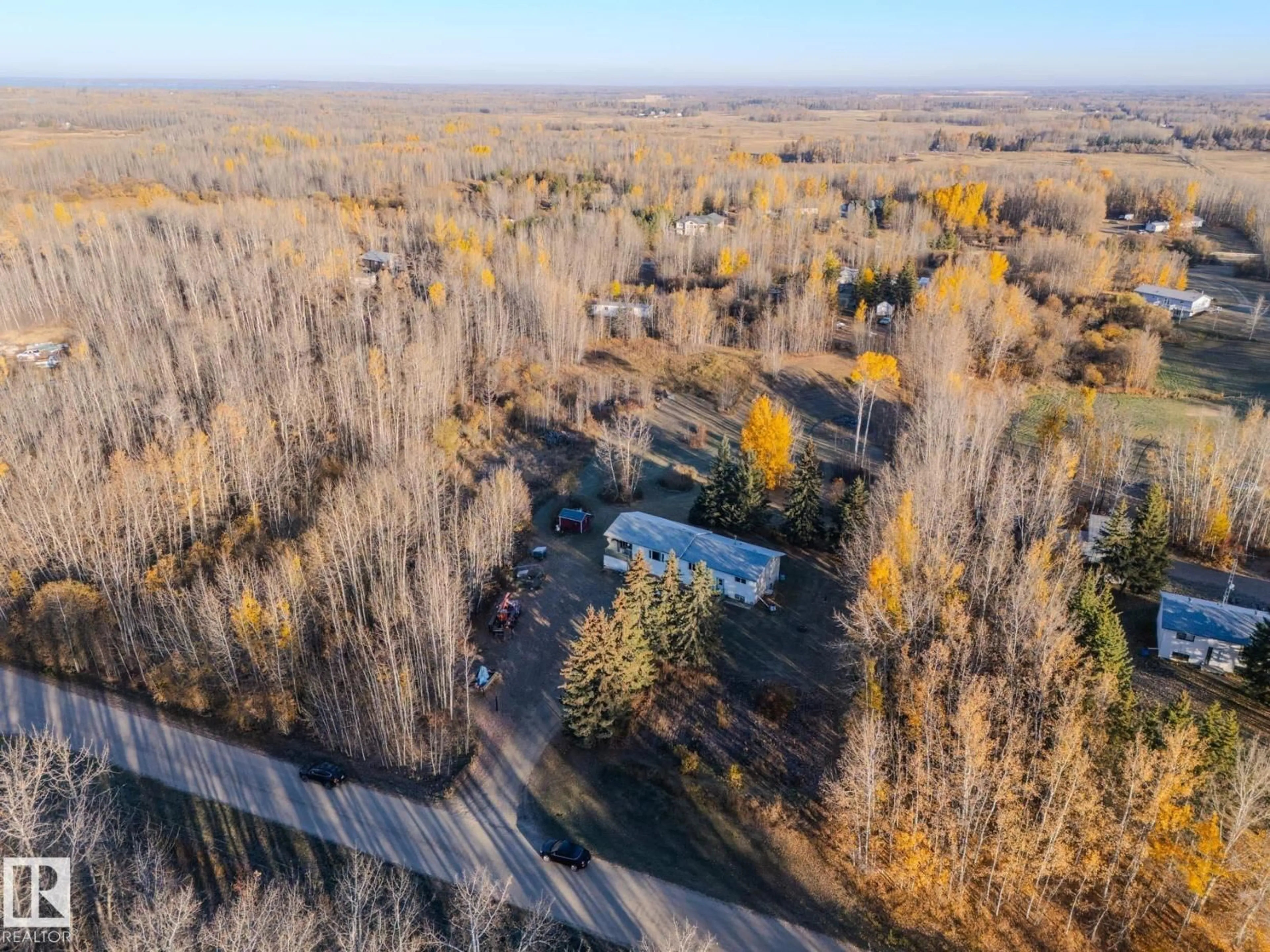 A pic from outside/outdoor area/front of a property/back of a property/a pic from drone, forest/trees view for #4 - 54222 RGE ROAD 25, Rural Lac Ste. Anne County Alberta T0E0A0