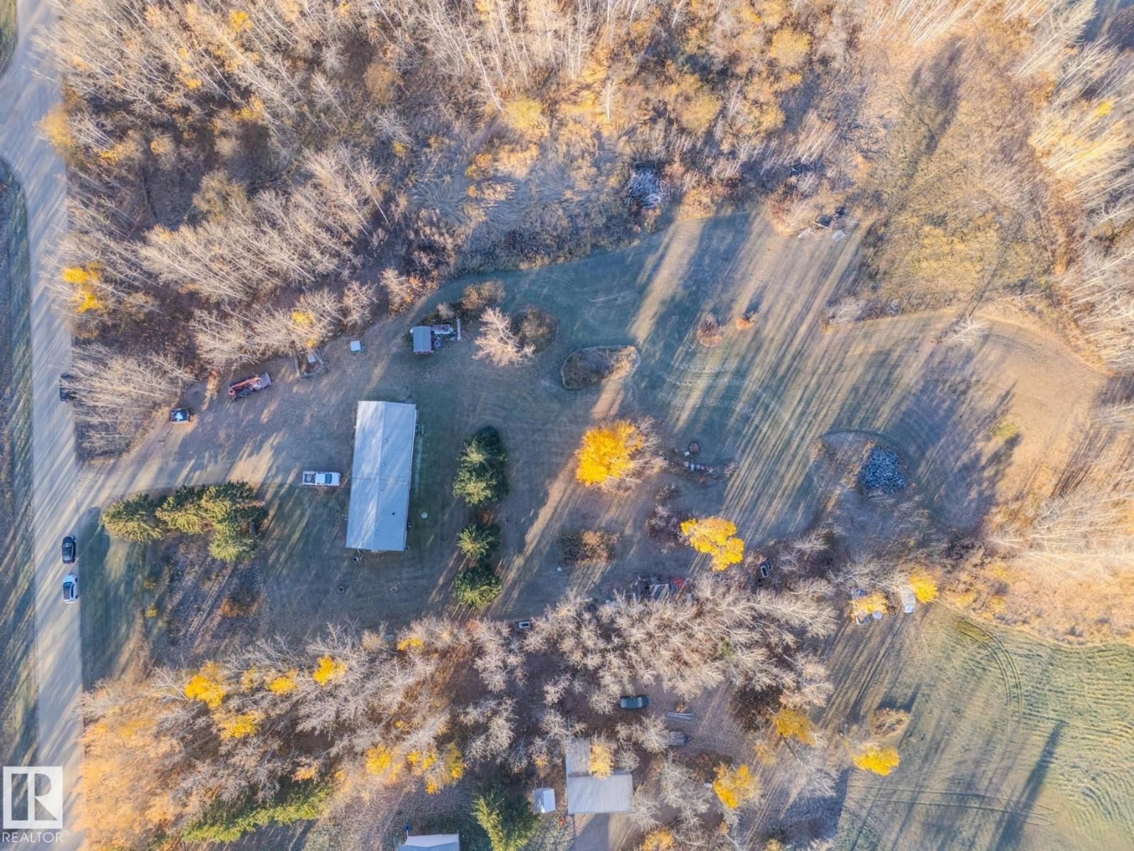 A pic from outside/outdoor area/front of a property/back of a property/a pic from drone, forest/trees view for #4 - 54222 RGE ROAD 25, Rural Lac Ste. Anne County Alberta T0E0A0