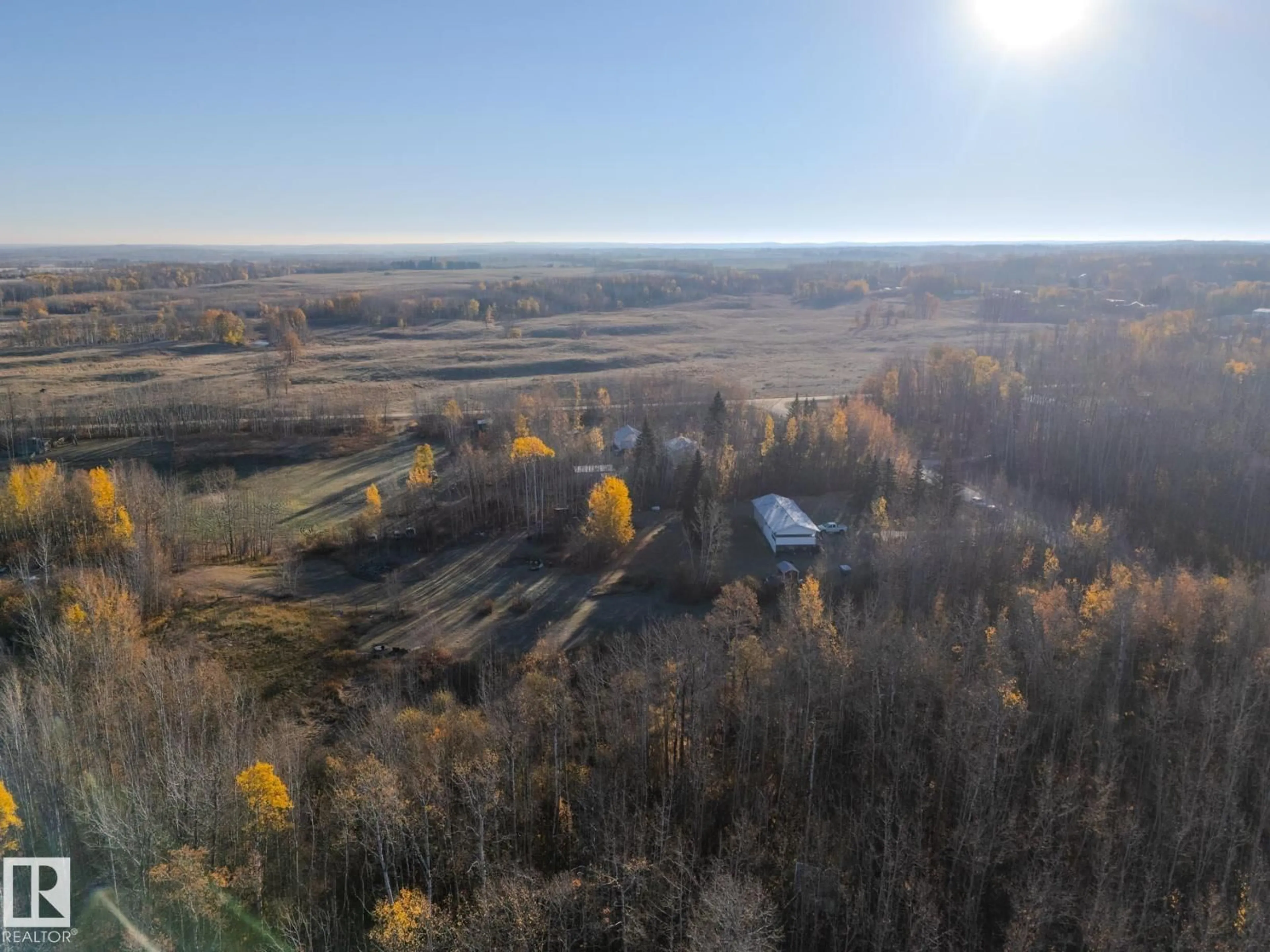 A pic from outside/outdoor area/front of a property/back of a property/a pic from drone, forest/trees view for #4 - 54222 RGE ROAD 25, Rural Lac Ste. Anne County Alberta T0E0A0