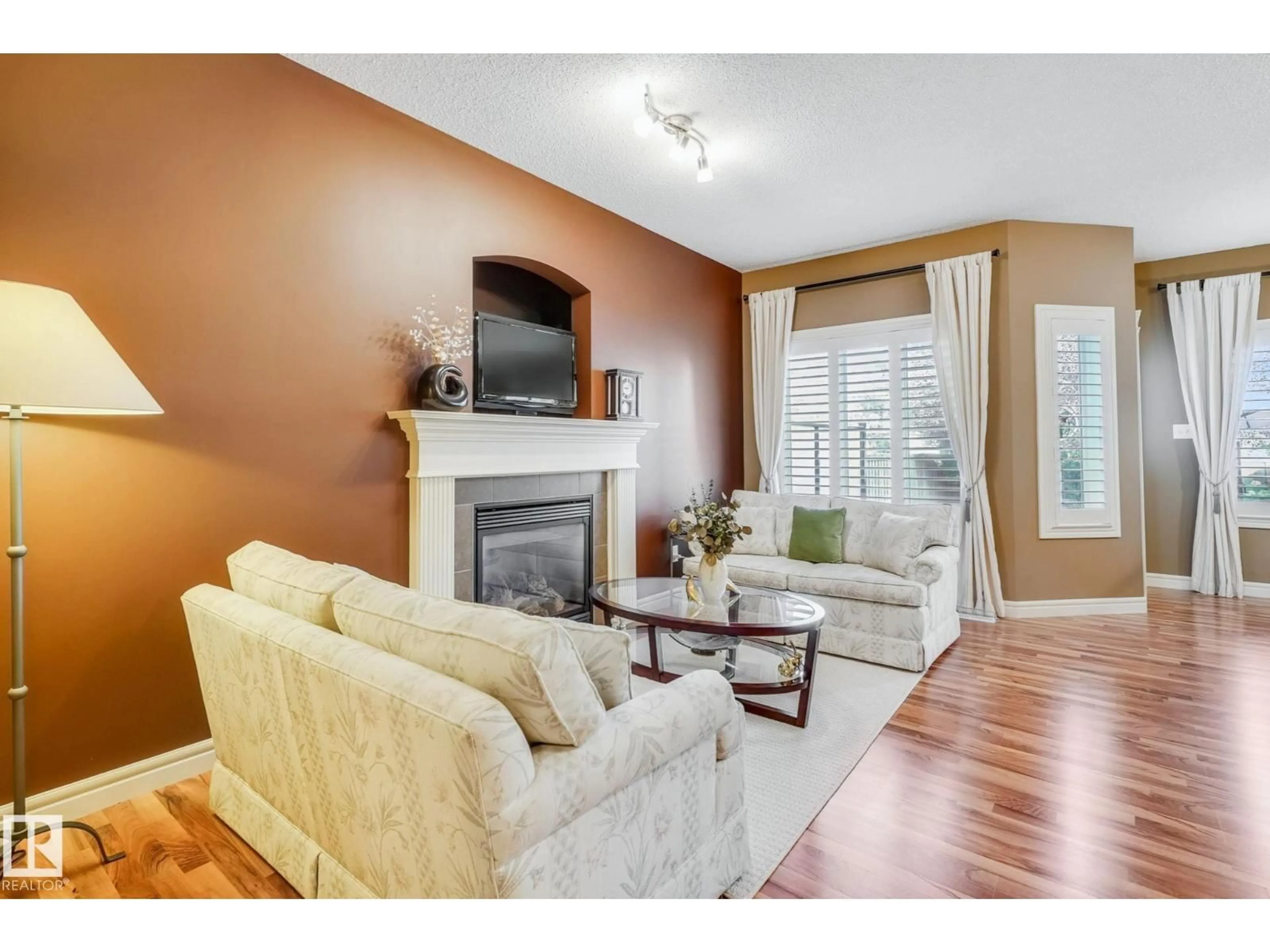 Living room with furniture, wood/laminate floor for SW - 1926 119A ST, Edmonton Alberta T6W0E2