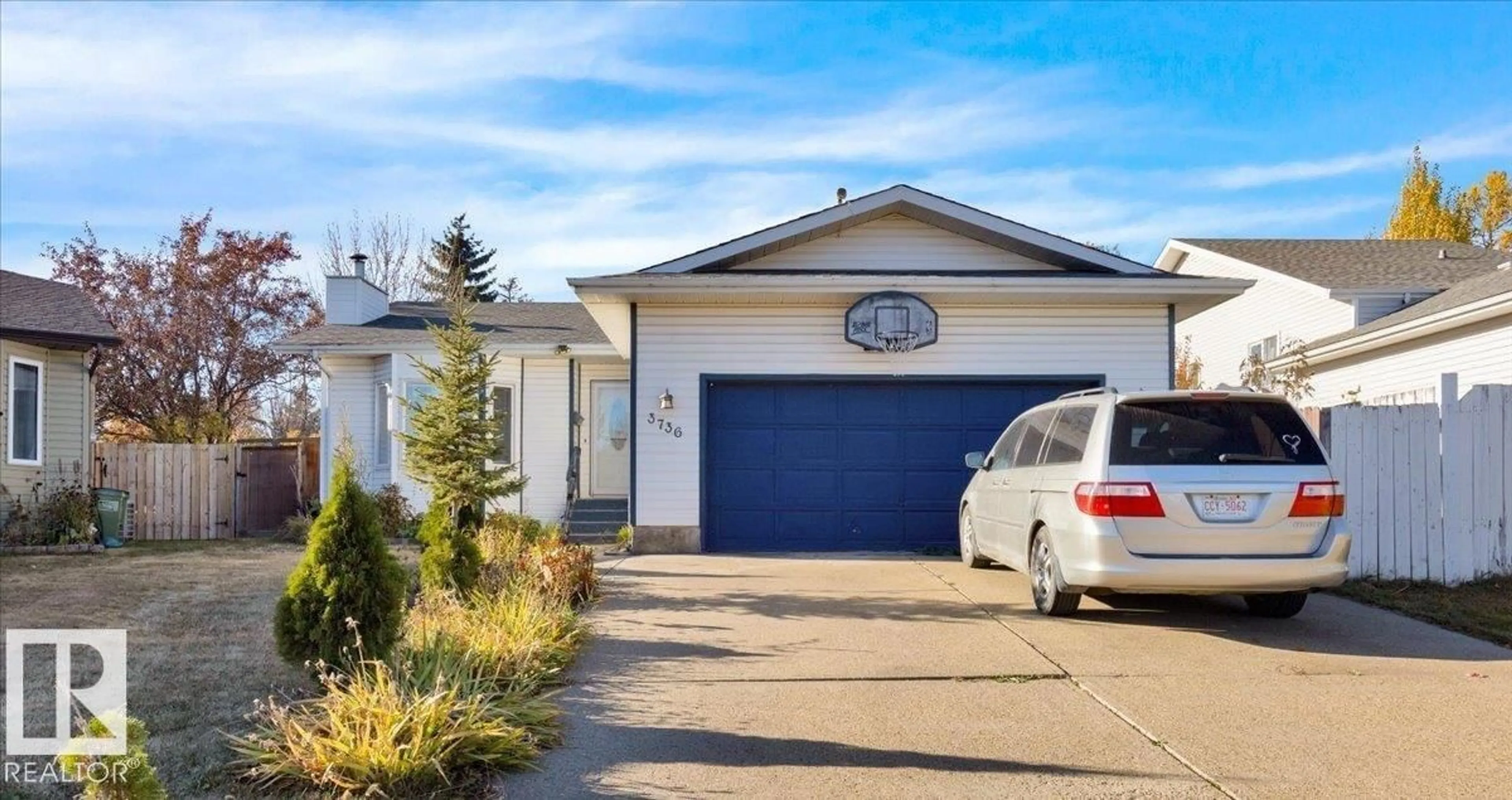 Home with vinyl exterior material, street for 3736 48 ST, Edmonton Alberta T6L3T3