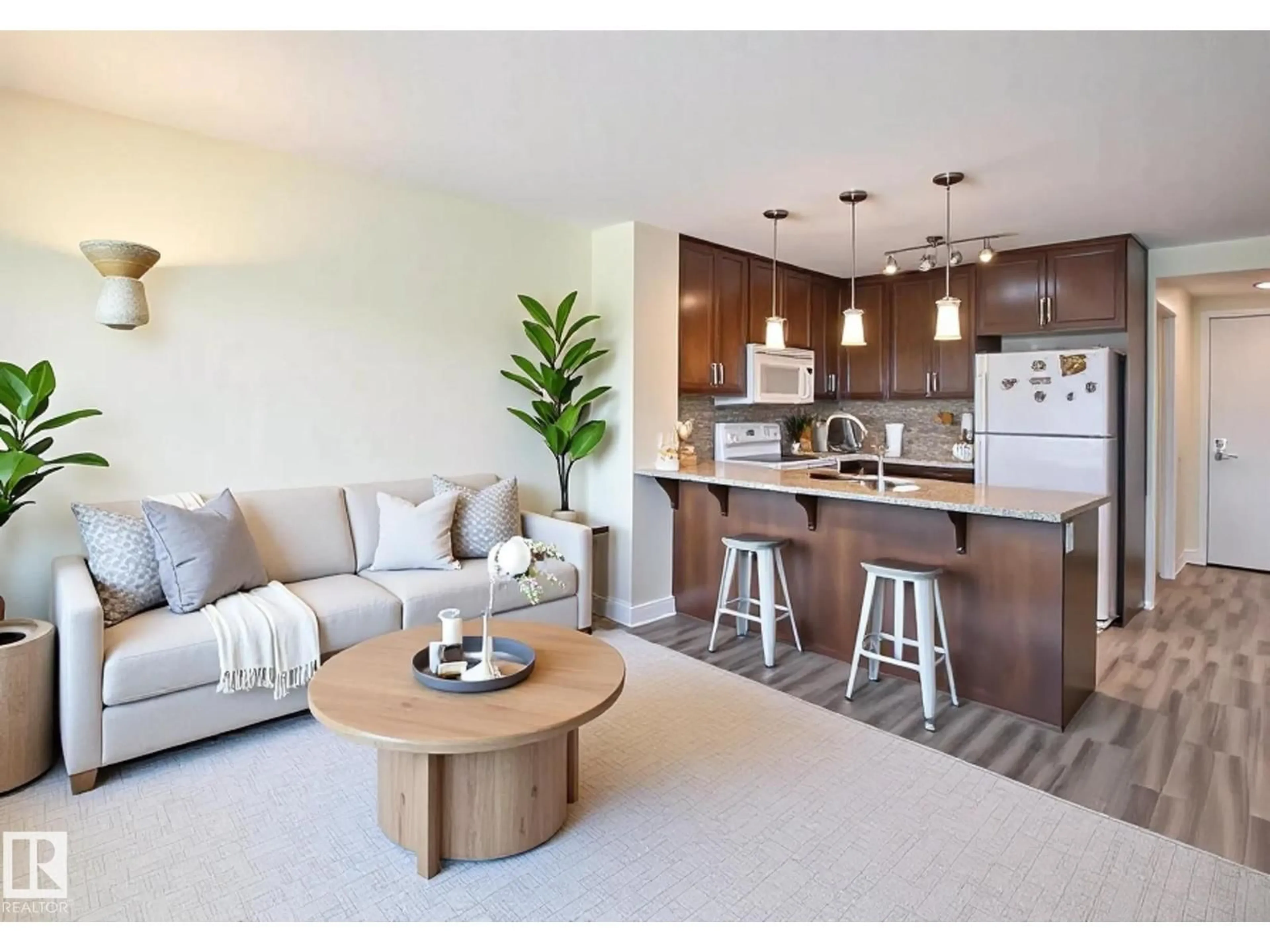Open concept kitchen, wood/laminate floor for #210 - 3670 139 AV, Edmonton Alberta T5Y3N5