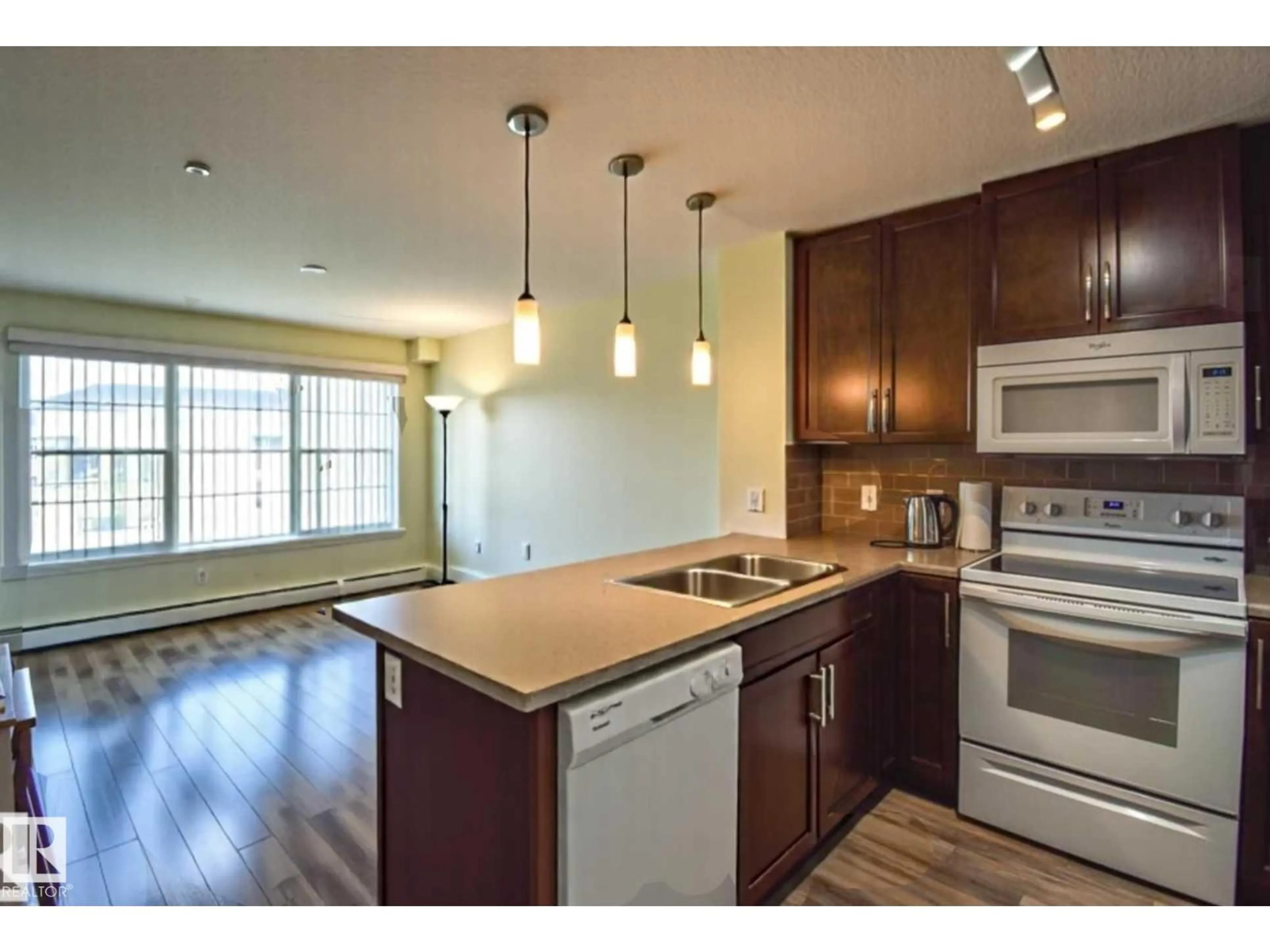 Standard kitchen, wood/laminate floor for #210 - 3670 139 AV, Edmonton Alberta T5Y3N5