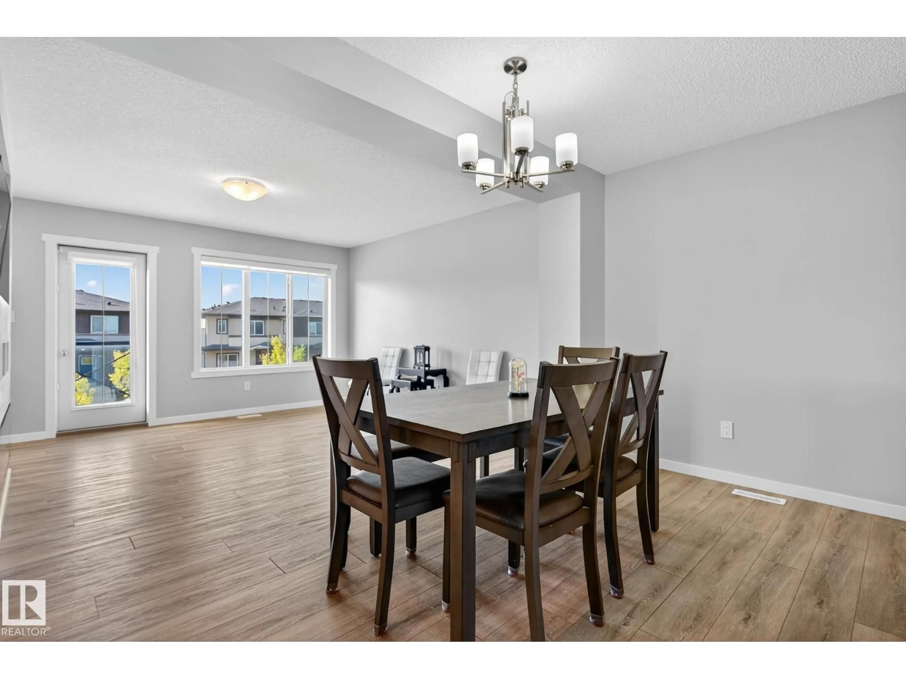Dining room, wood/laminate floor for 1089 CY BECKER RD, Edmonton Alberta T5Y4B7