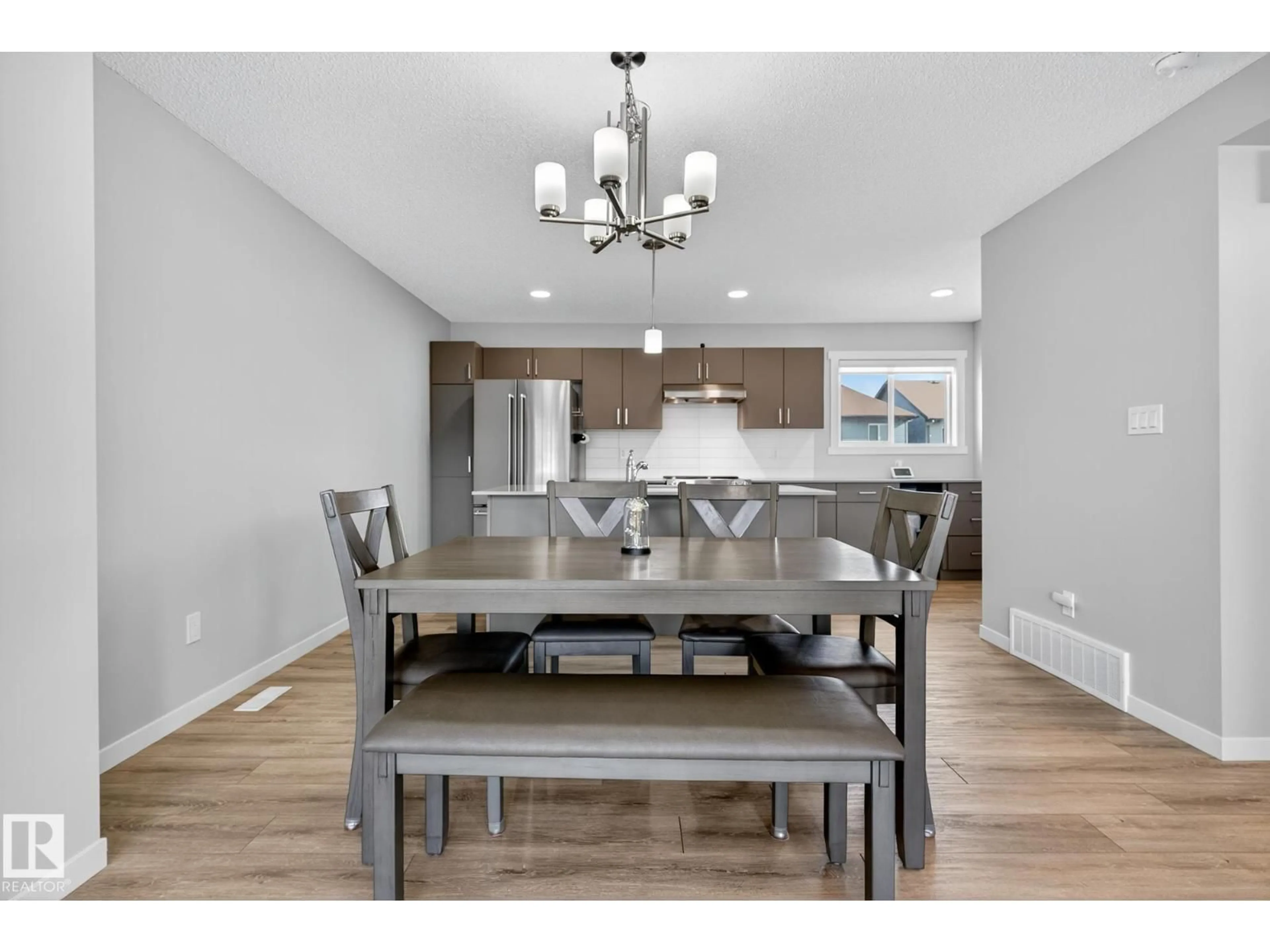 Dining room, wood/laminate floor for 1089 CY BECKER RD, Edmonton Alberta T5Y4B7