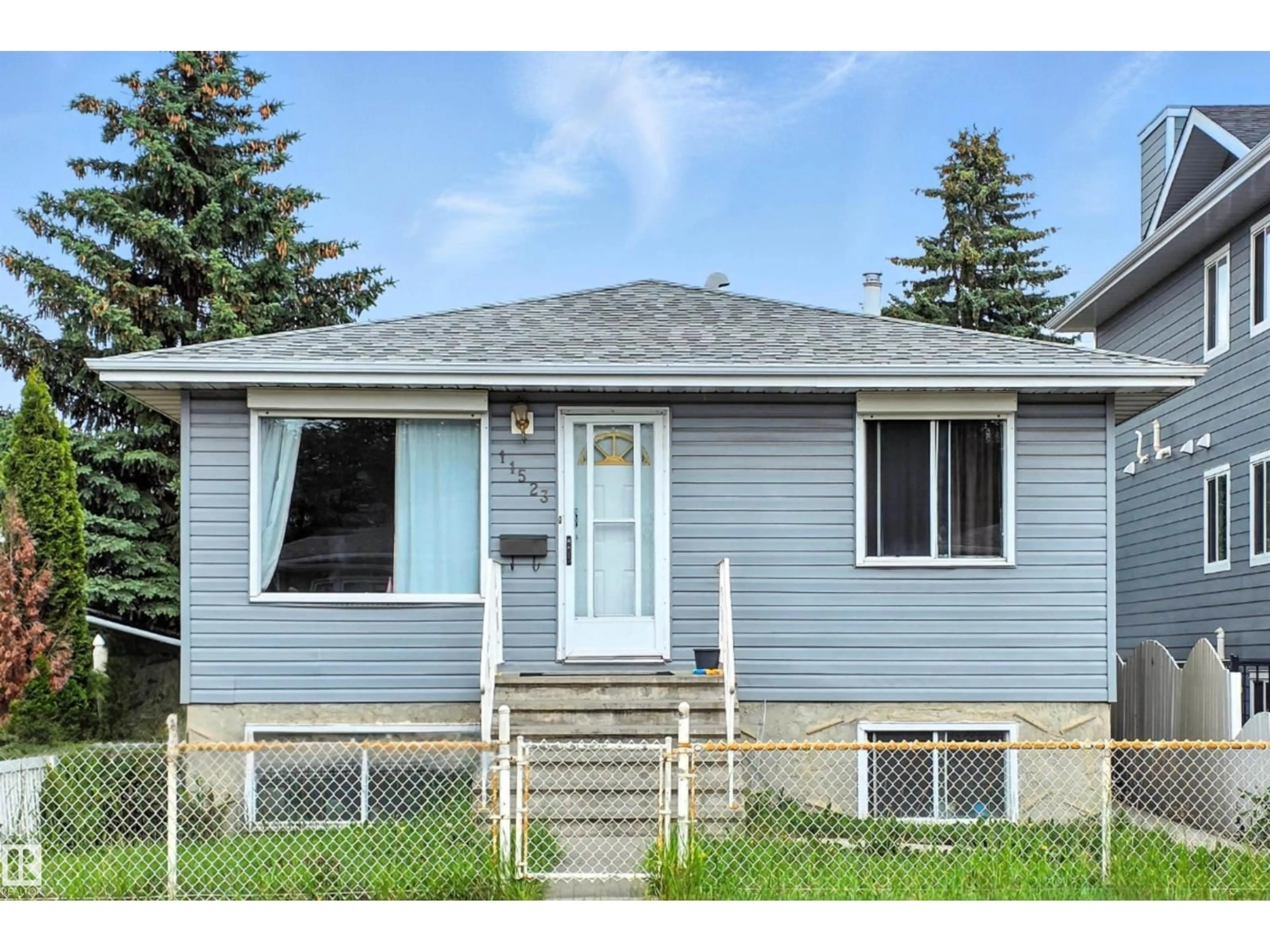 Home with vinyl exterior material, street for NW - 11523 82 ST, Edmonton Alberta T5B2V7
