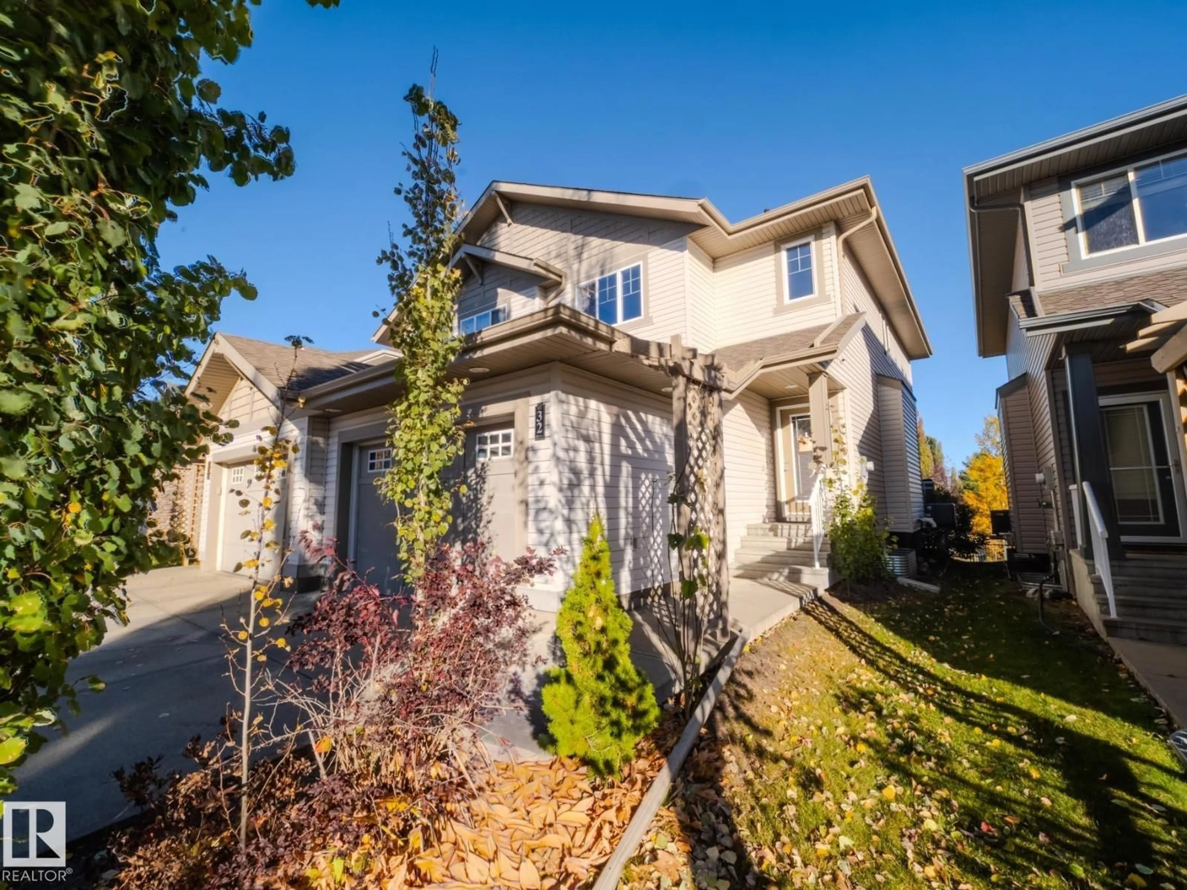 Home with vinyl exterior material, street for #32 - 1901 126 ST SW, Edmonton Alberta T6W0R9