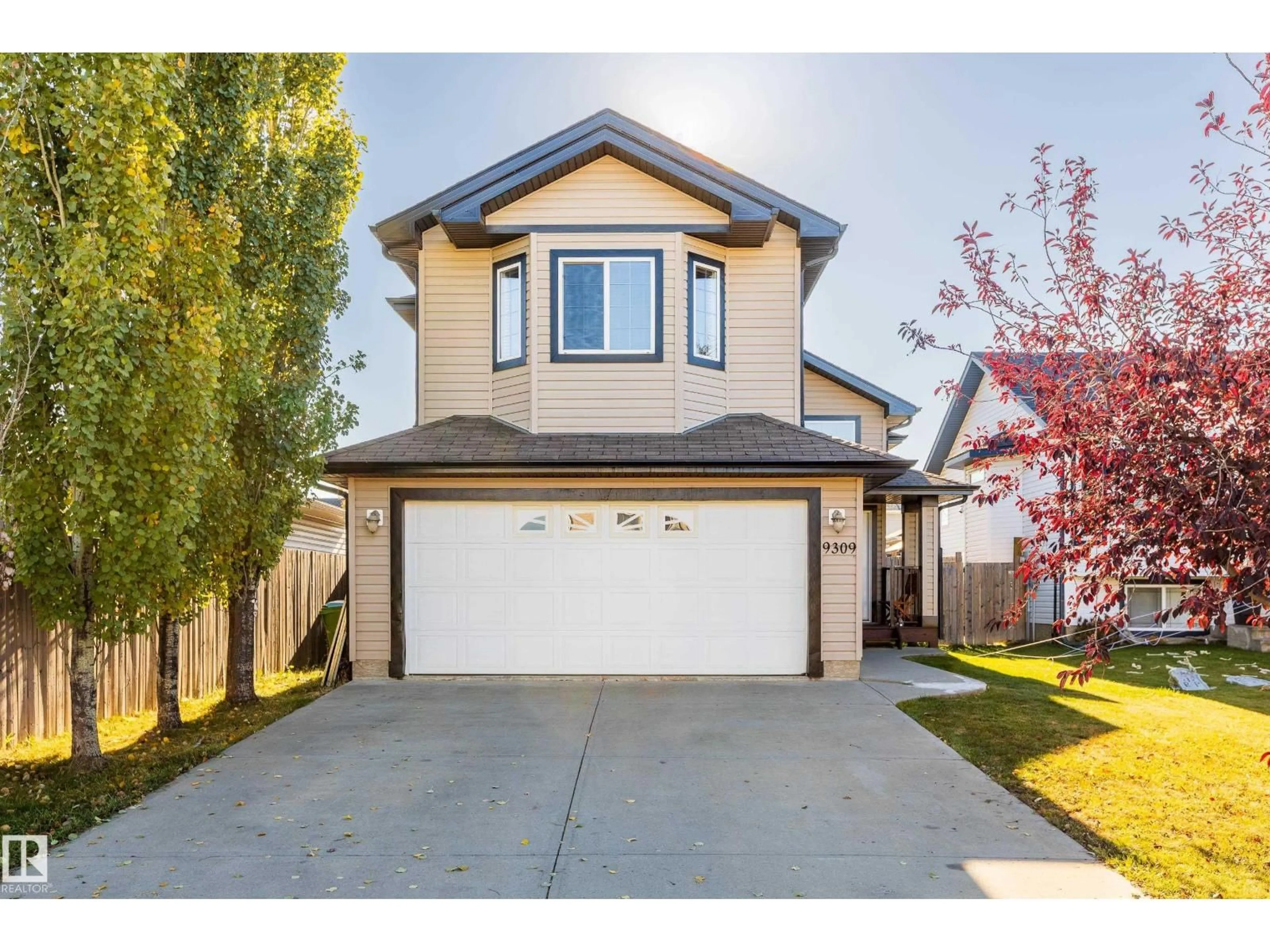 Home with vinyl exterior material, street for 9309 106 AV, Morinville Alberta T8R1T9