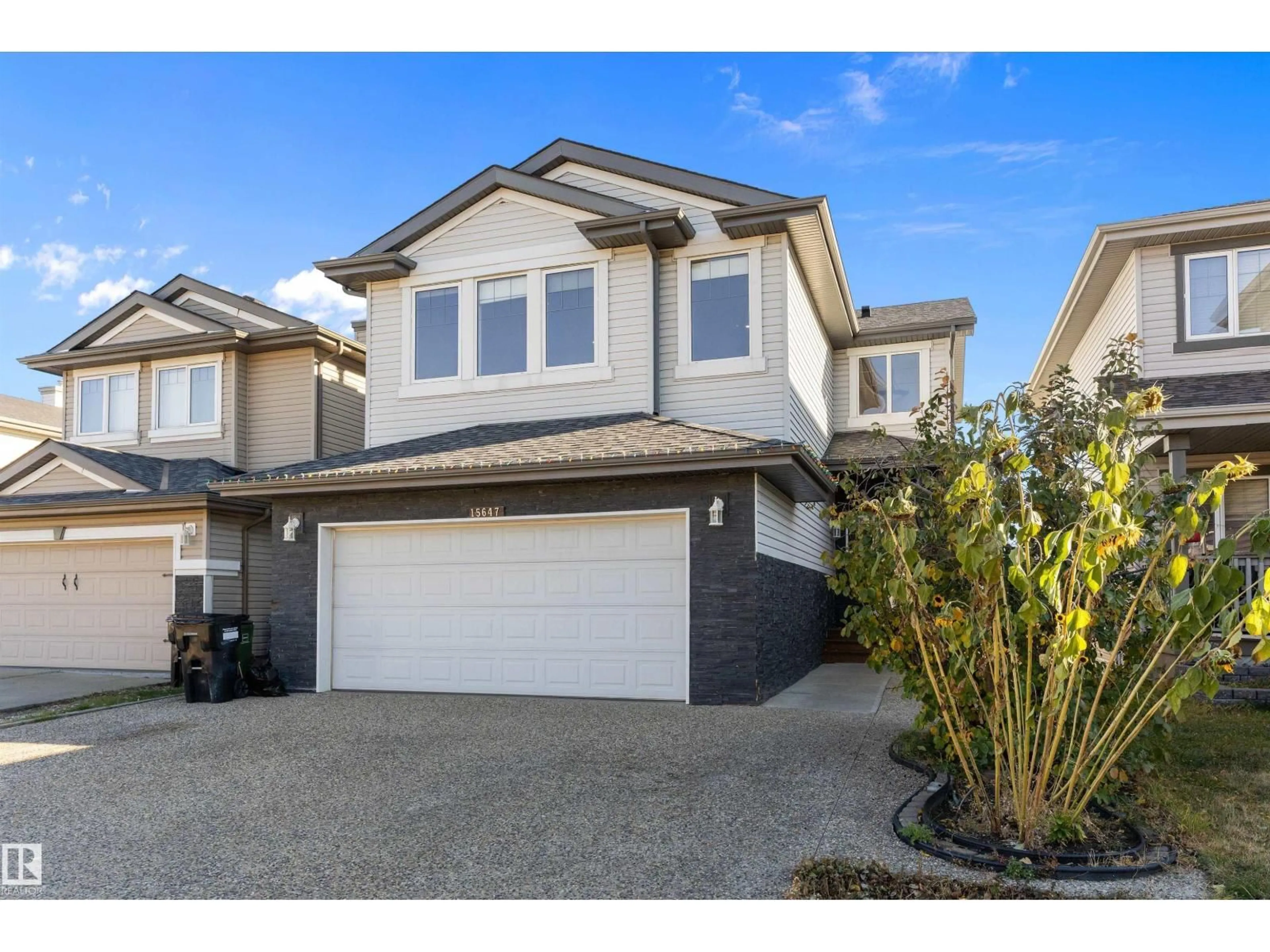 Home with vinyl exterior material, street for NW - 15647 42 ST, Edmonton Alberta T5Y0C9