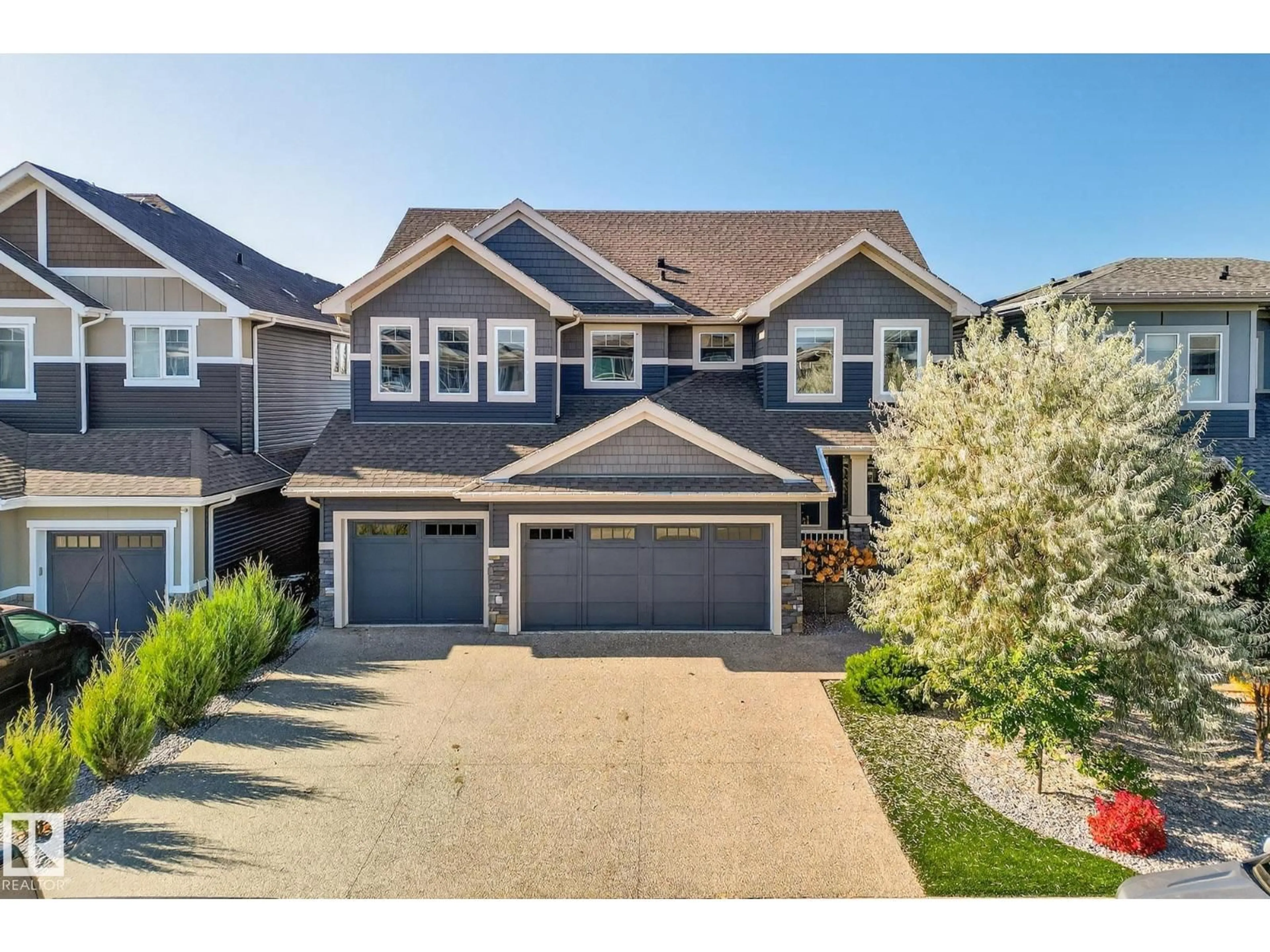 A pic from outside/outdoor area/front of a property/back of a property/a pic from drone, street for 724 180 ST, Edmonton Alberta T6W2S8