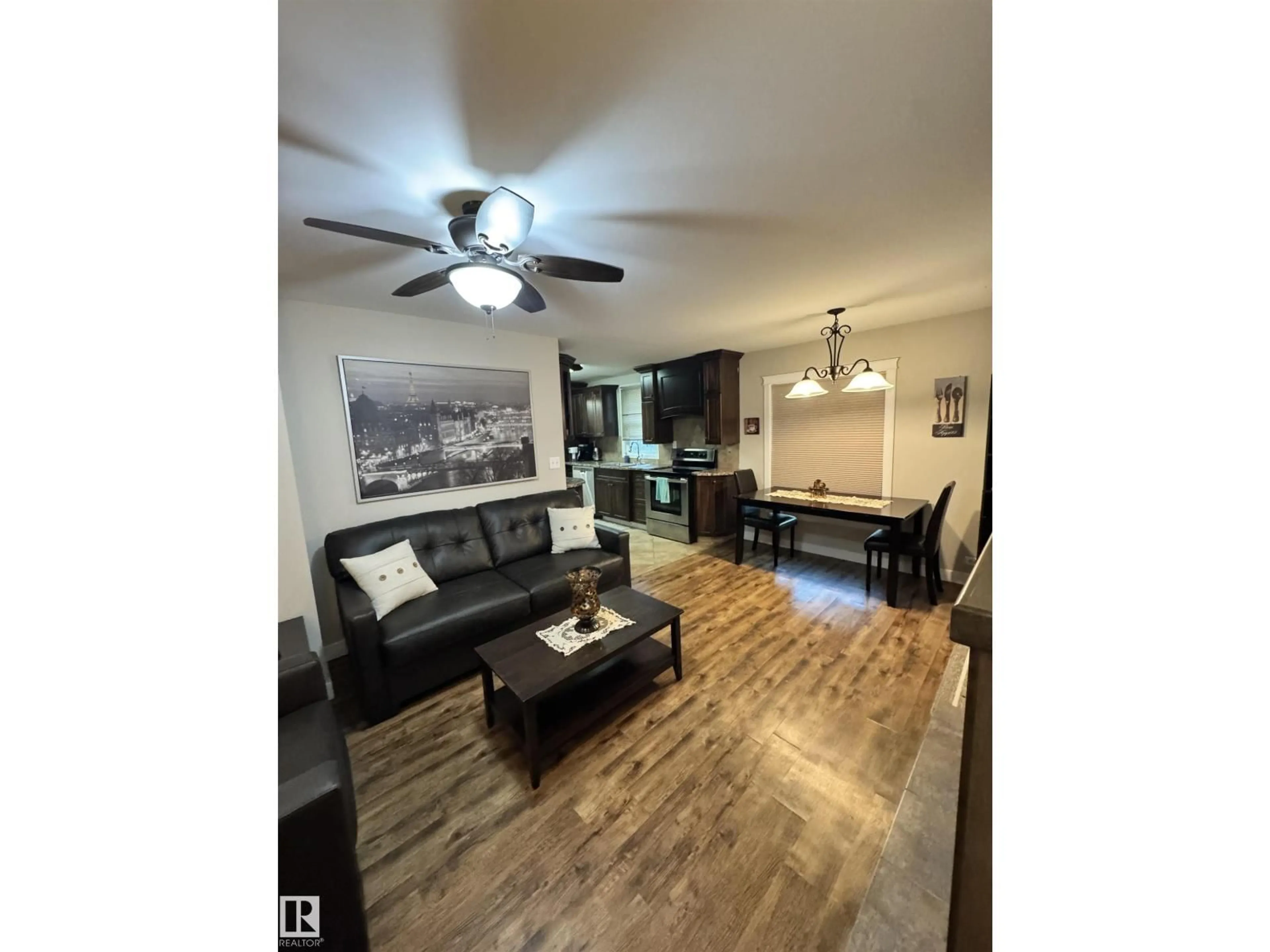 Living room with furniture, wood/laminate floor for 10115 105 ST, Westlock Alberta T7P1V9
