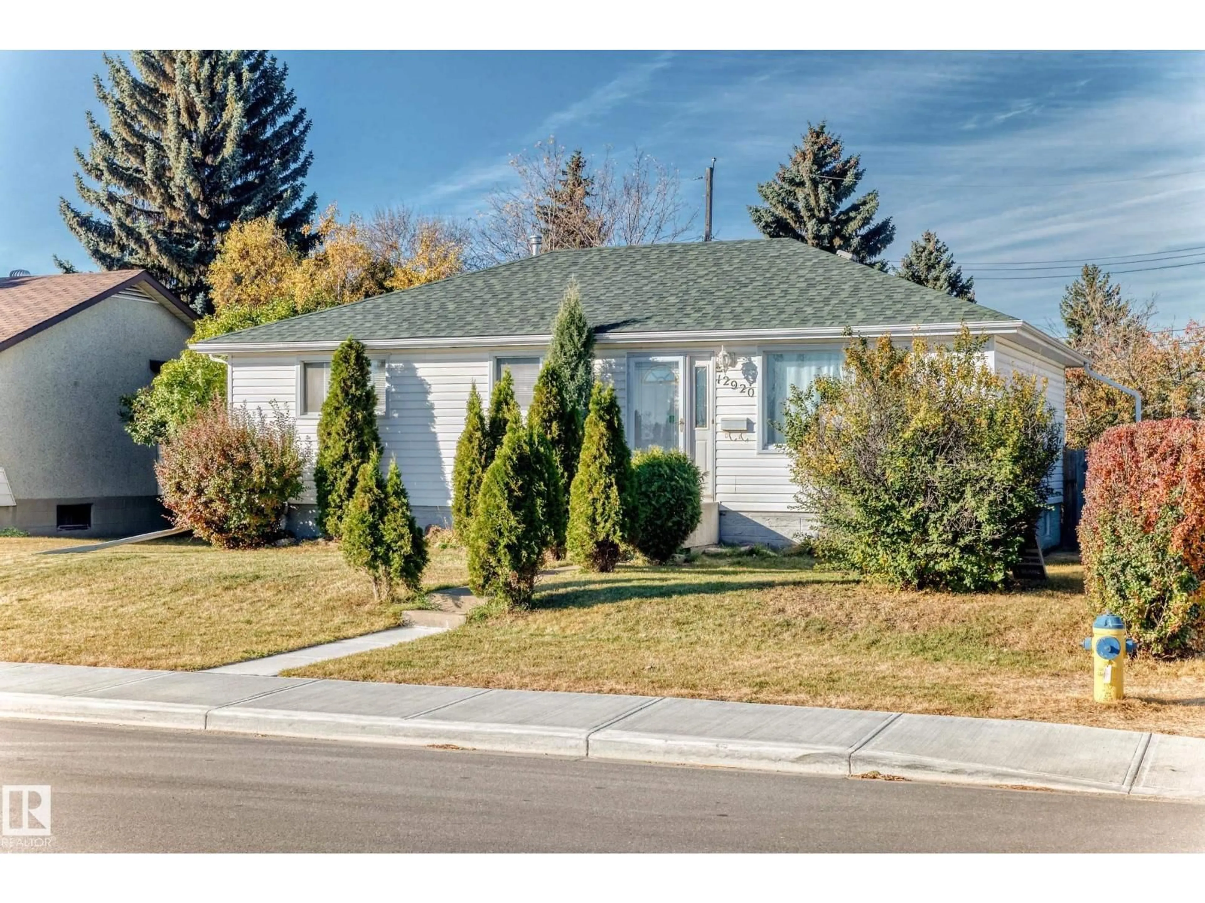 Home with vinyl exterior material, street for 12920 93 ST, Edmonton Alberta T5E3T2