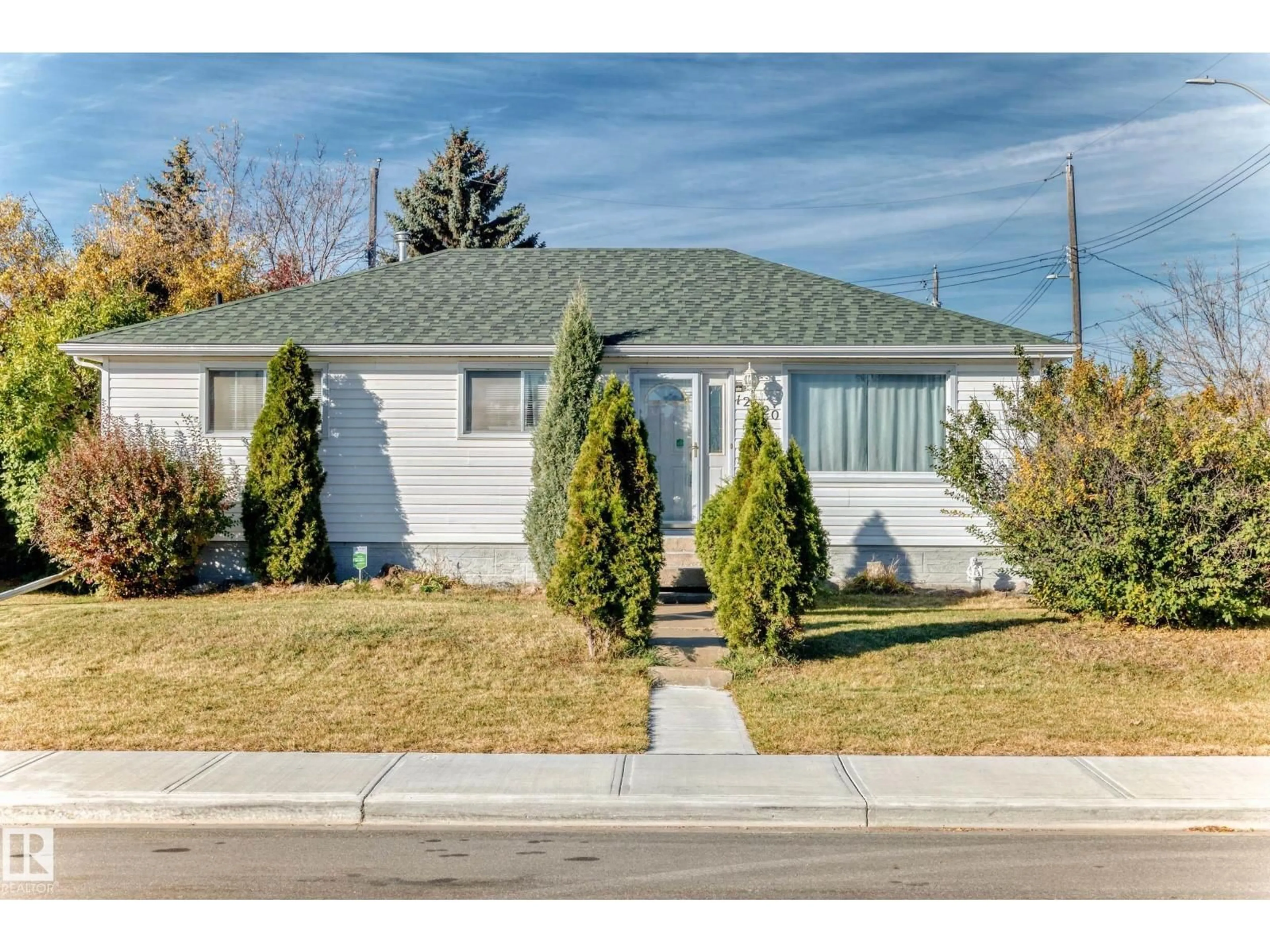Home with vinyl exterior material, street for 12920 93 ST, Edmonton Alberta T5E3T2
