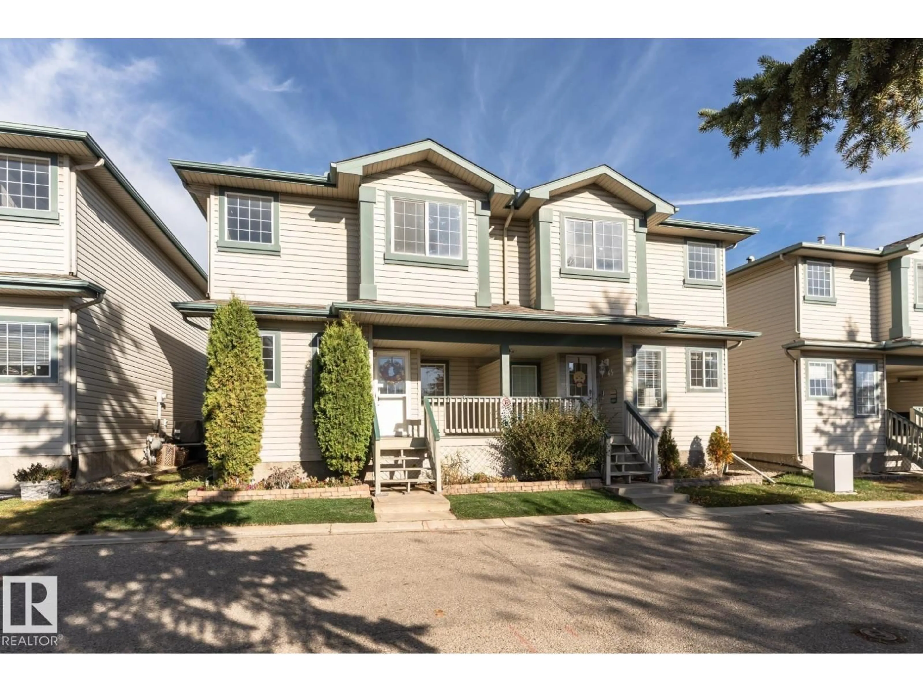 Home with vinyl exterior material, street for 14803 - 46 MILLER BV, Edmonton Alberta T5Y3A4