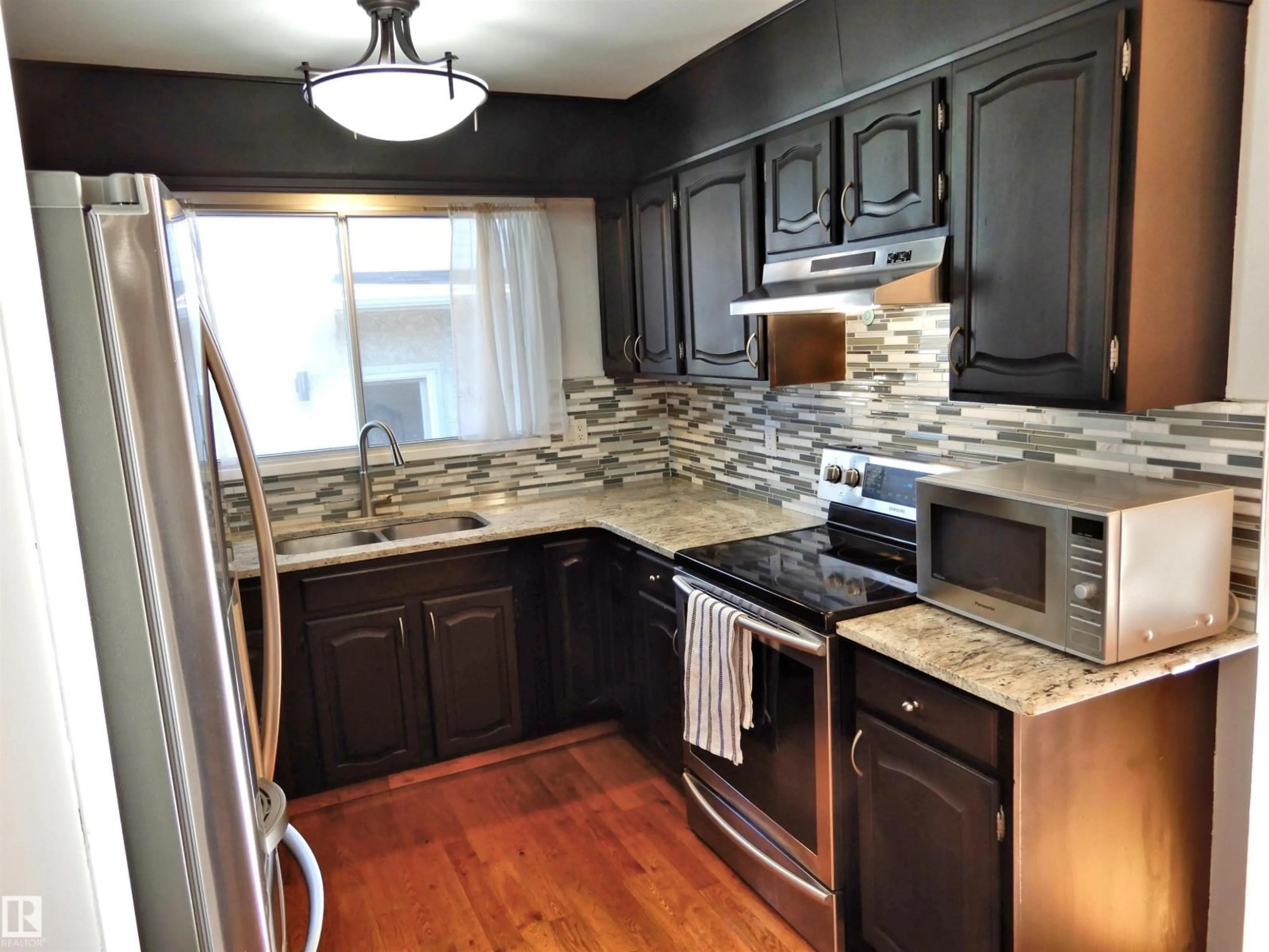 Open concept kitchen, unknown for NW - 18617 62B AV, Edmonton Alberta T5T2S8