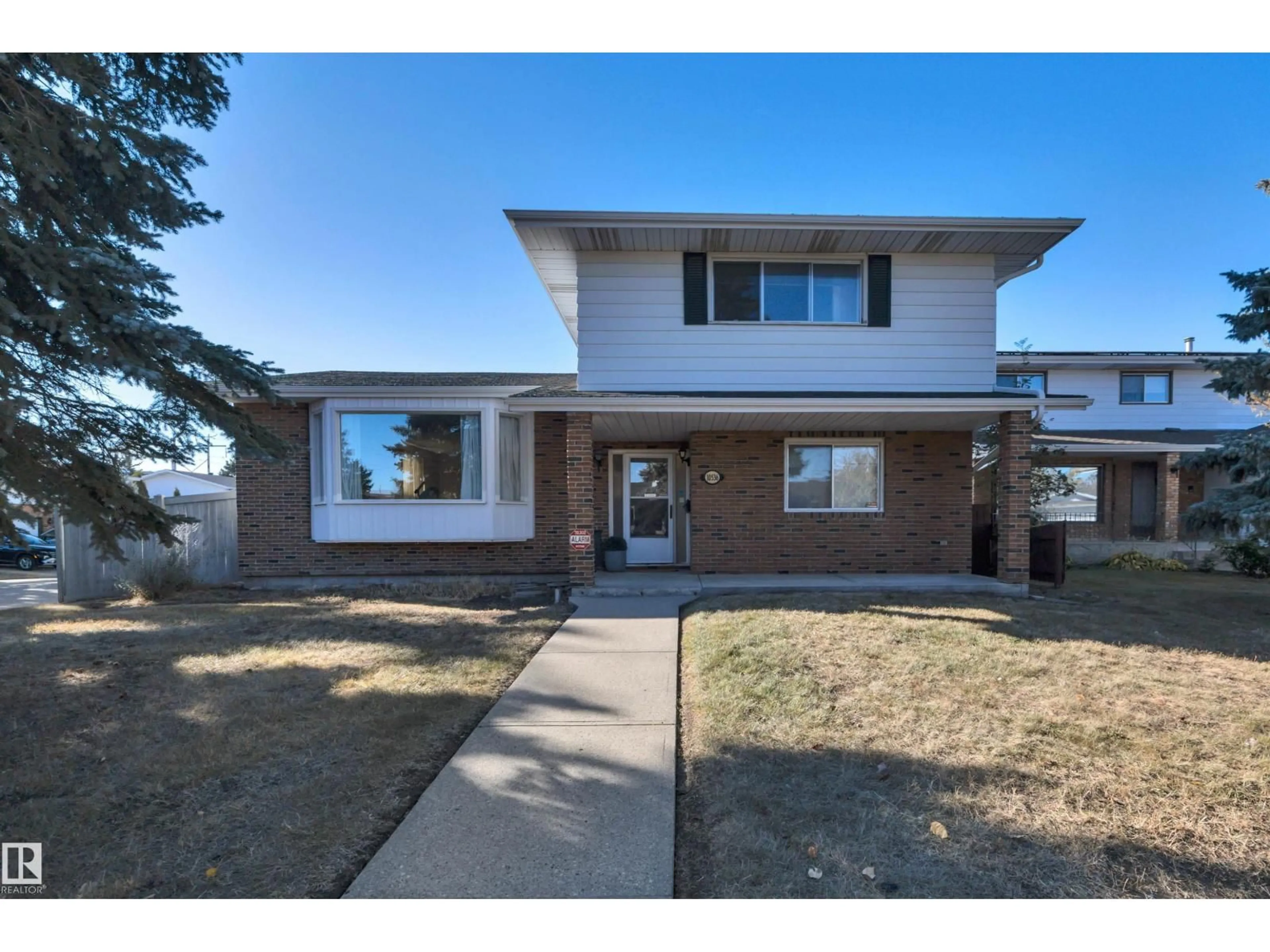 Home with brick exterior material, street for NW - 10536 30 AV, Edmonton Alberta T6J2Y2