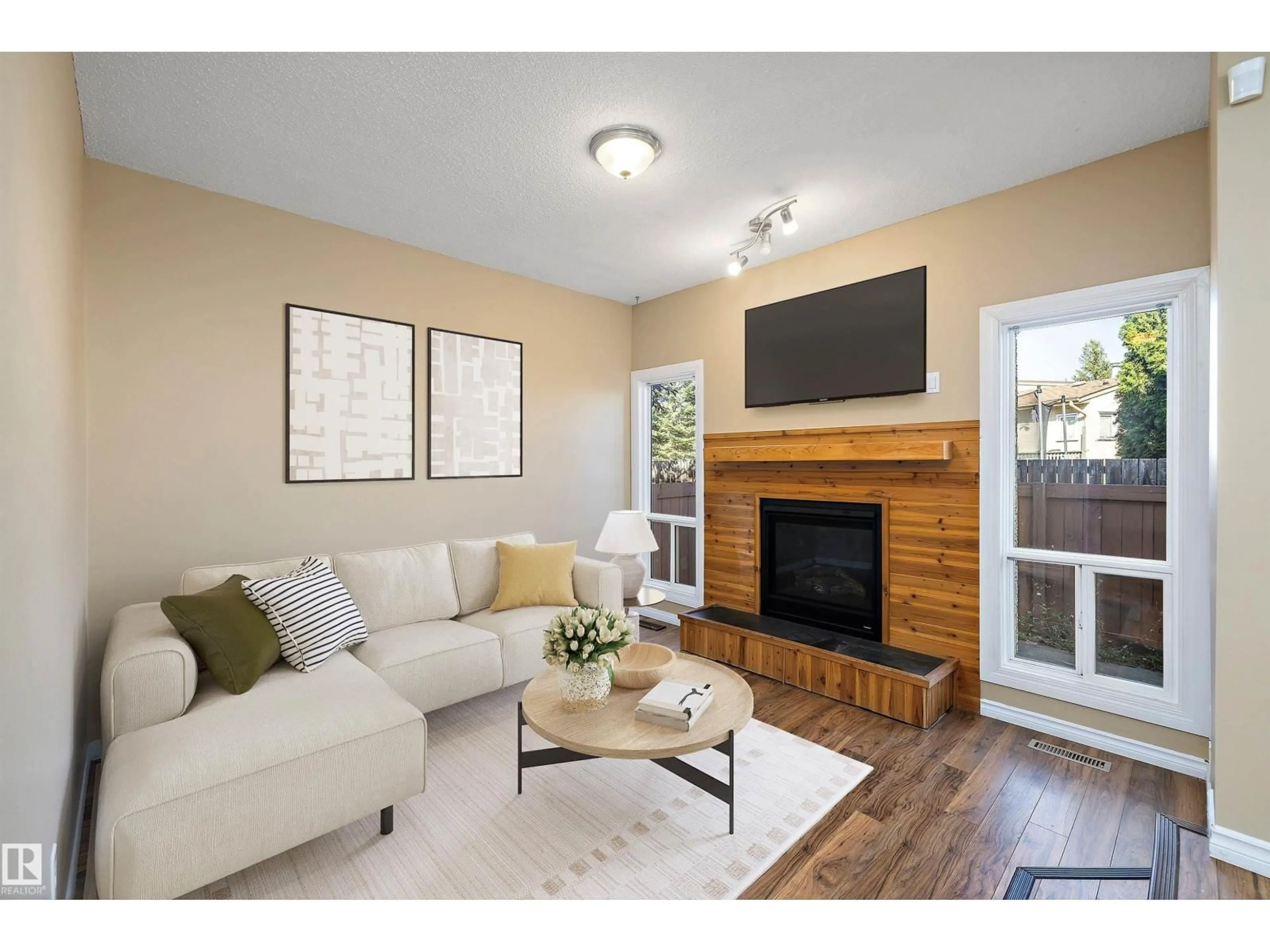 Living room with furniture, wood/laminate floor for 54 - 3812 20 AV, Edmonton Alberta T6L4B2