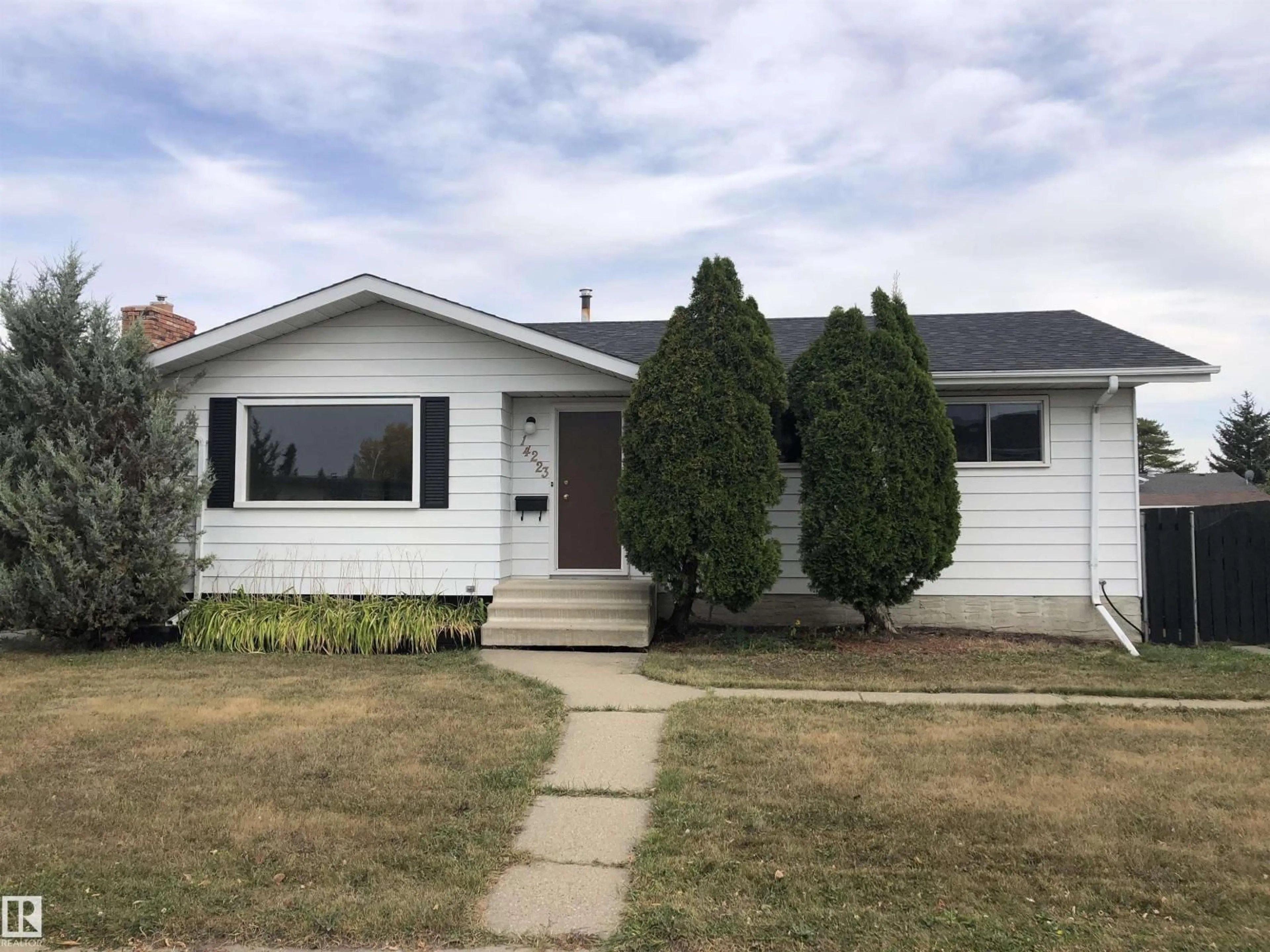 Home with vinyl exterior material, street for 14223 116 ST, Edmonton Alberta T5X1M9