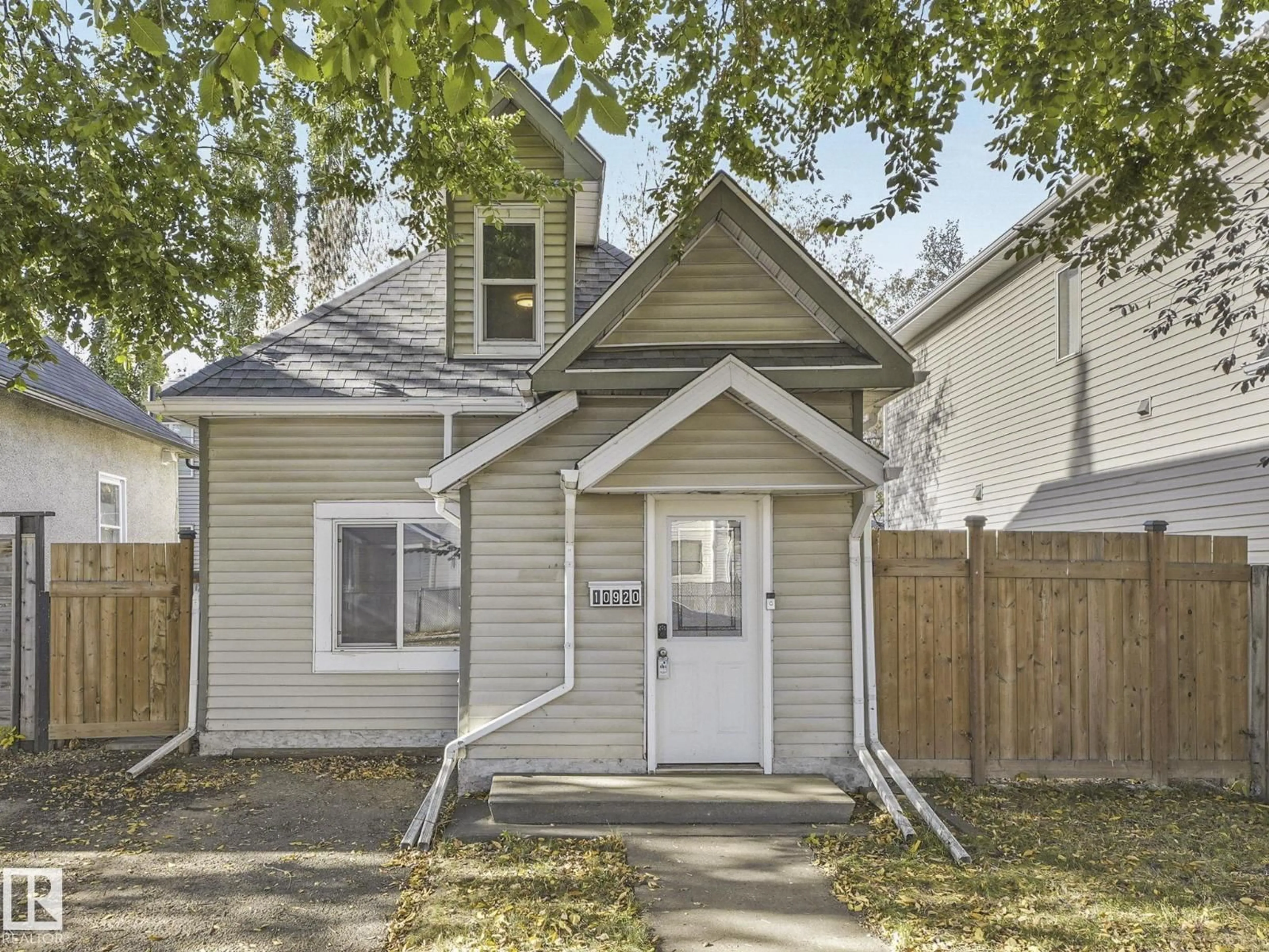 Home with vinyl exterior material, street for NW - 10920 92 ST, Edmonton Alberta T5H1W1
