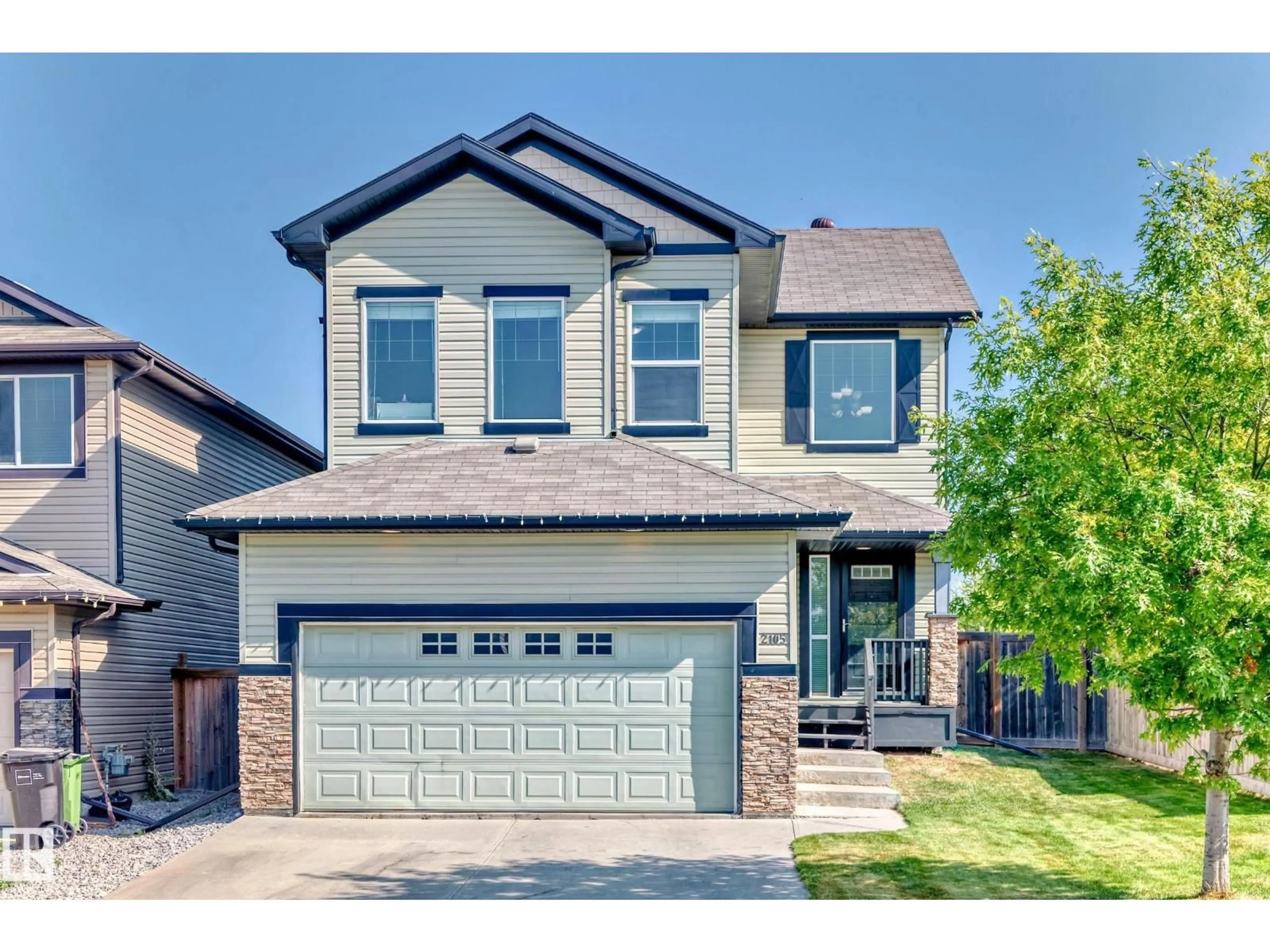 Home with brick exterior material, street for NW - 2105 32A ST, Edmonton Alberta T6T0K4