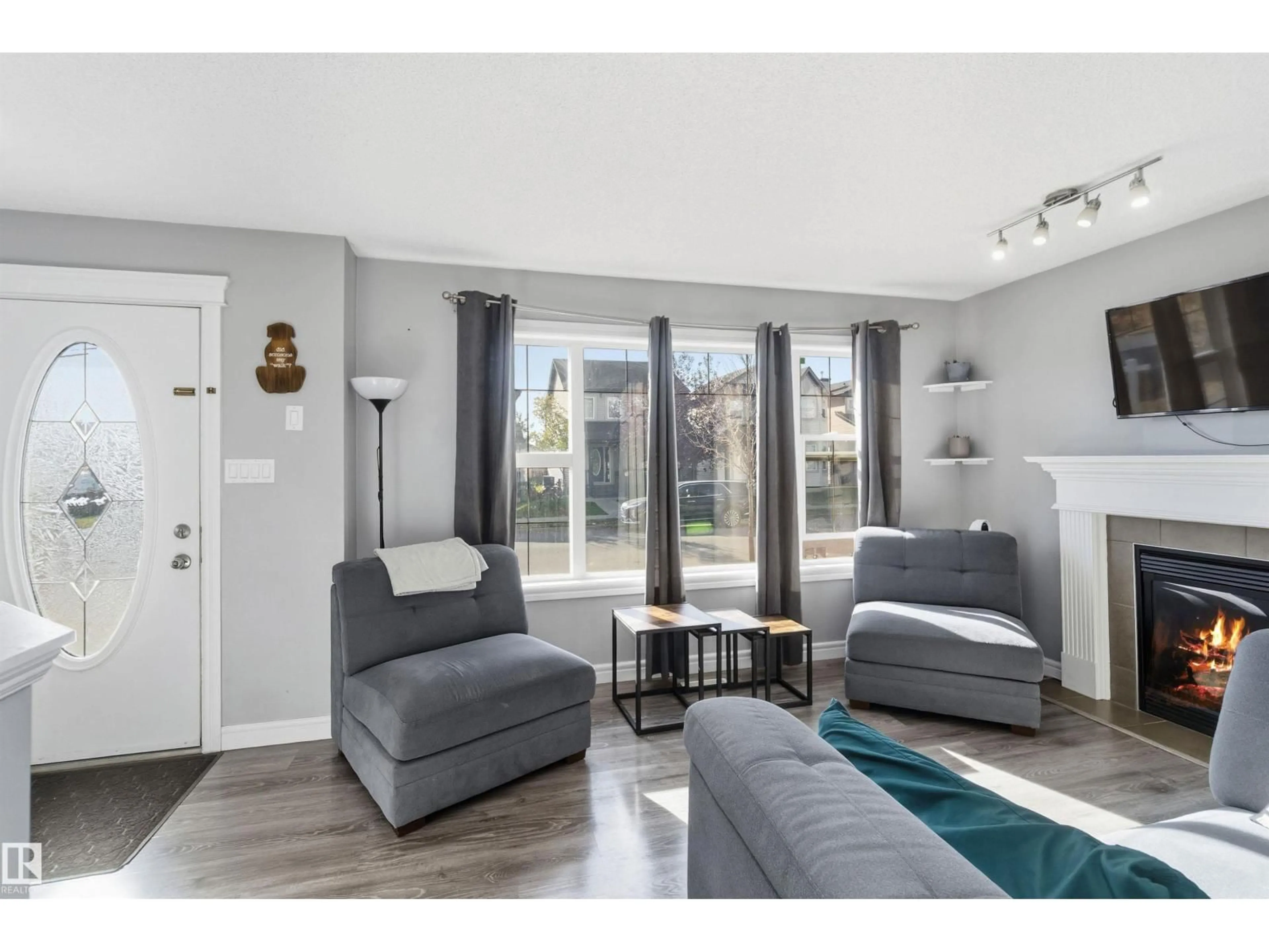 Living room with furniture, unknown for NW - 3908 161 AV, Edmonton Alberta T5Y3J8