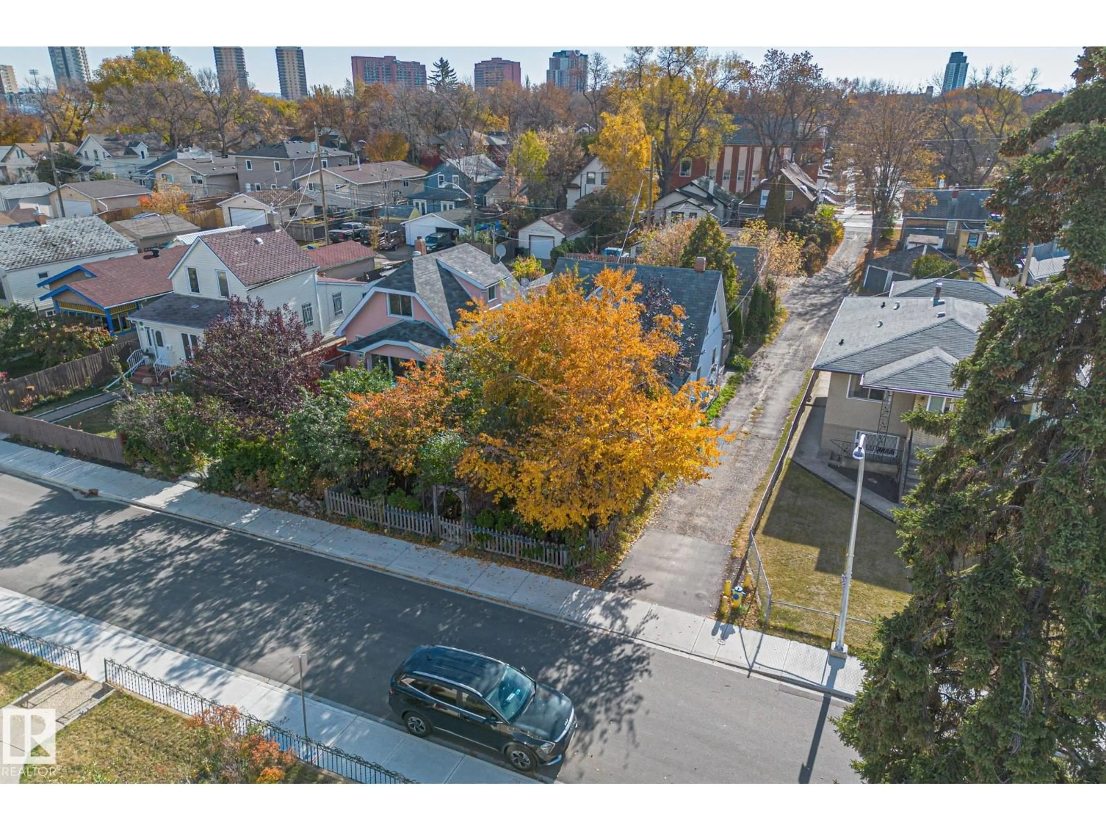 A pic from outside/outdoor area/front of a property/back of a property/a pic from drone, street for 9325 110 AV, Edmonton Alberta T5H1H2