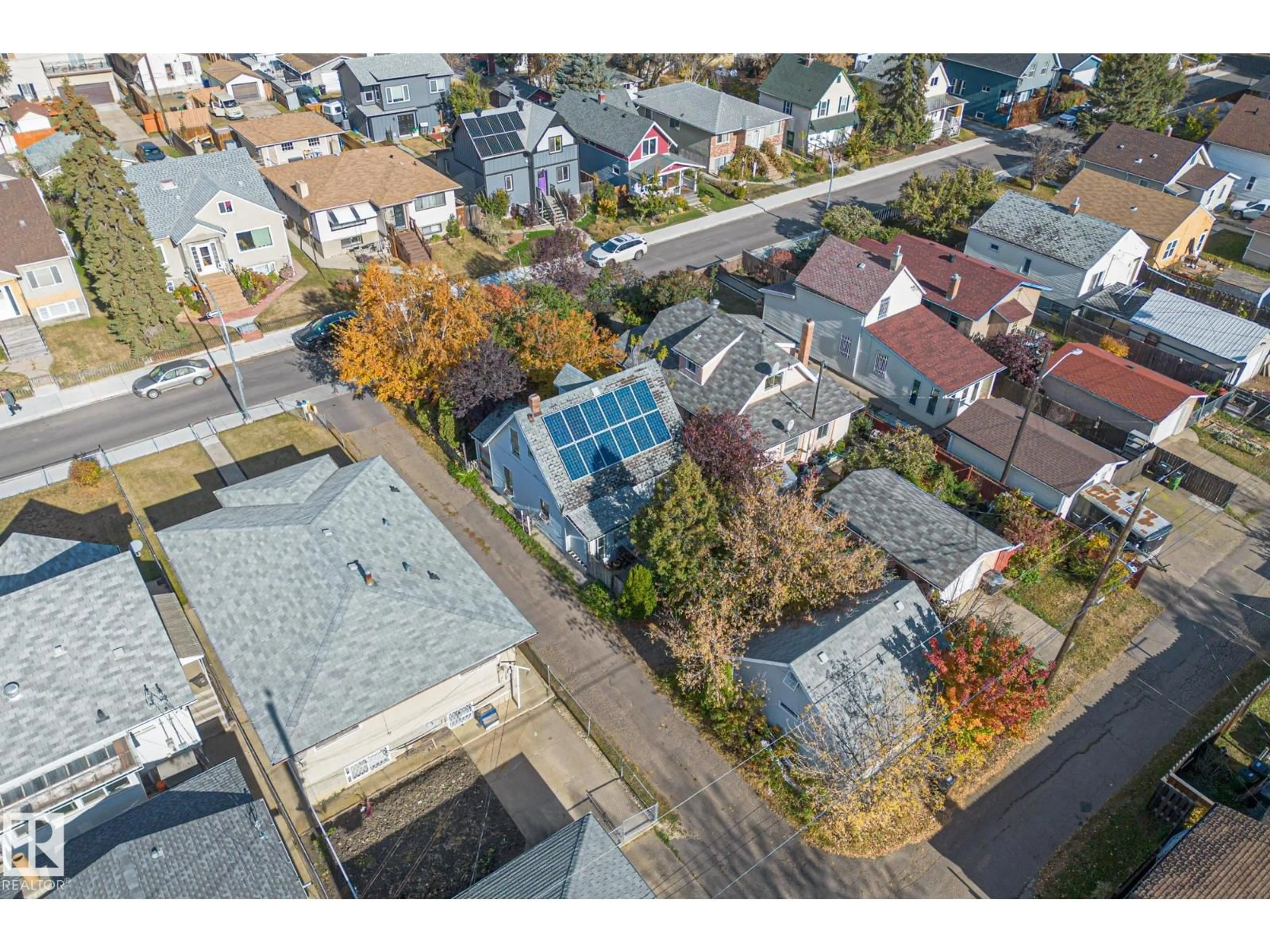 A pic from outside/outdoor area/front of a property/back of a property/a pic from drone, street for 9325 110 AV, Edmonton Alberta T5H1H2
