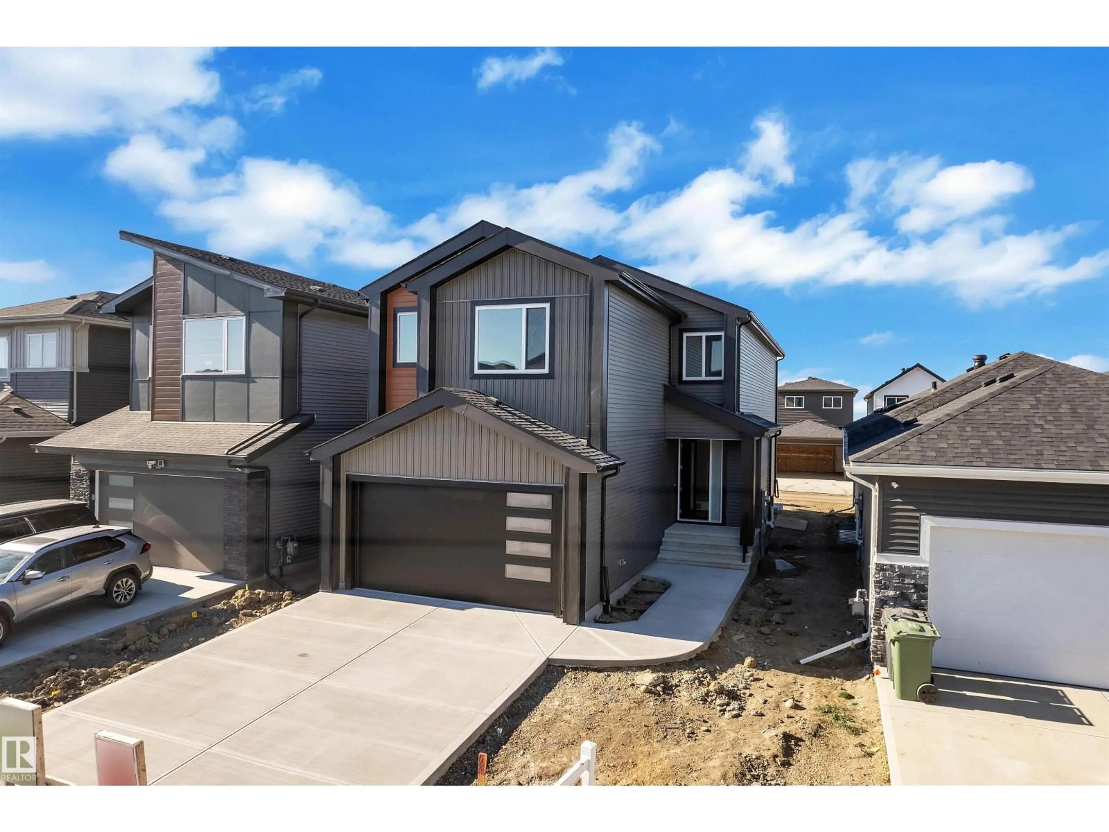 Home with vinyl exterior material, street for 139 CREEKSIDE LN, Leduc Alberta T9E1T1