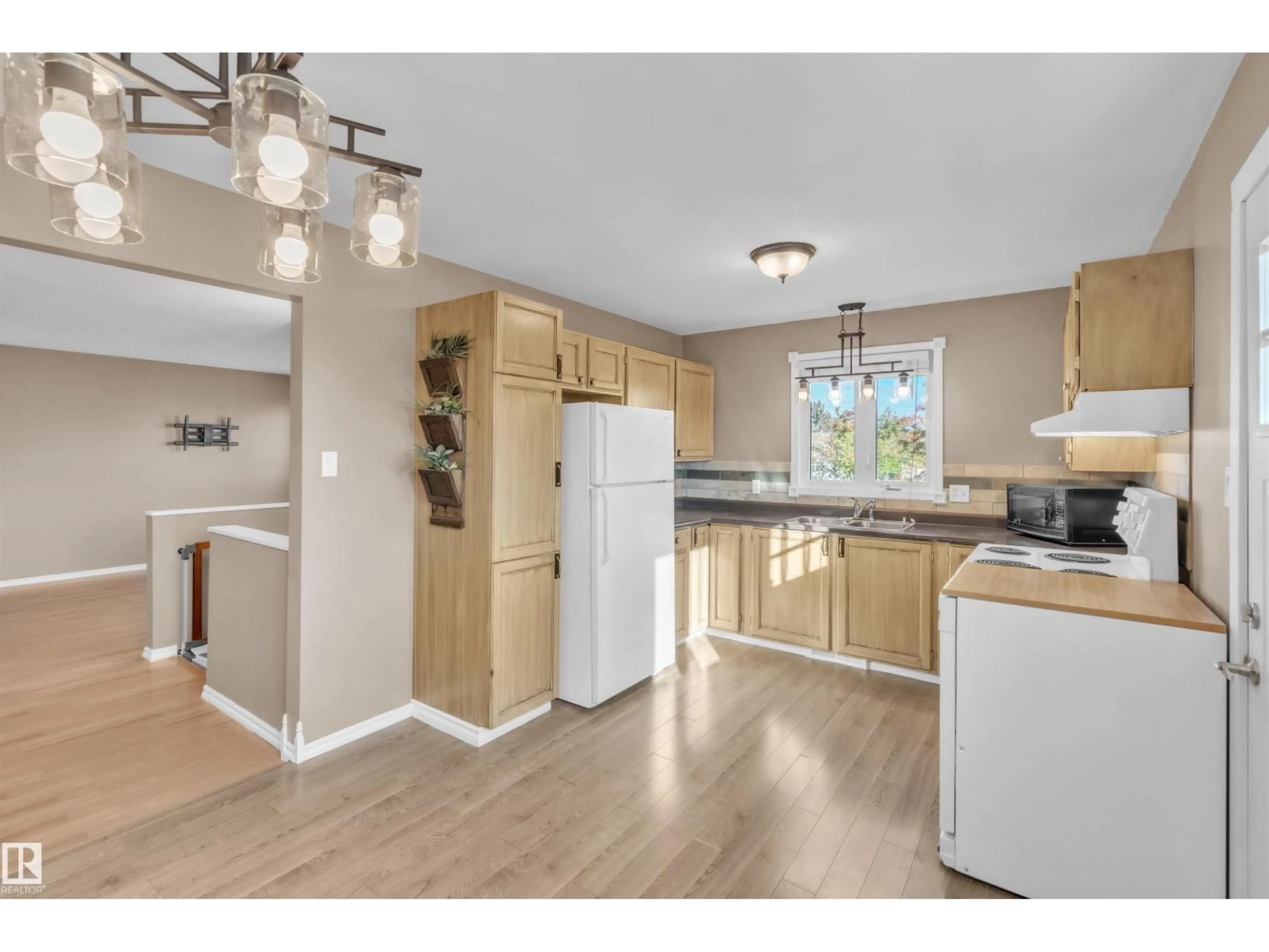 Open concept kitchen, wood/laminate floor for 1818 FOREST DR, Cold Lake Alberta T9M1L9