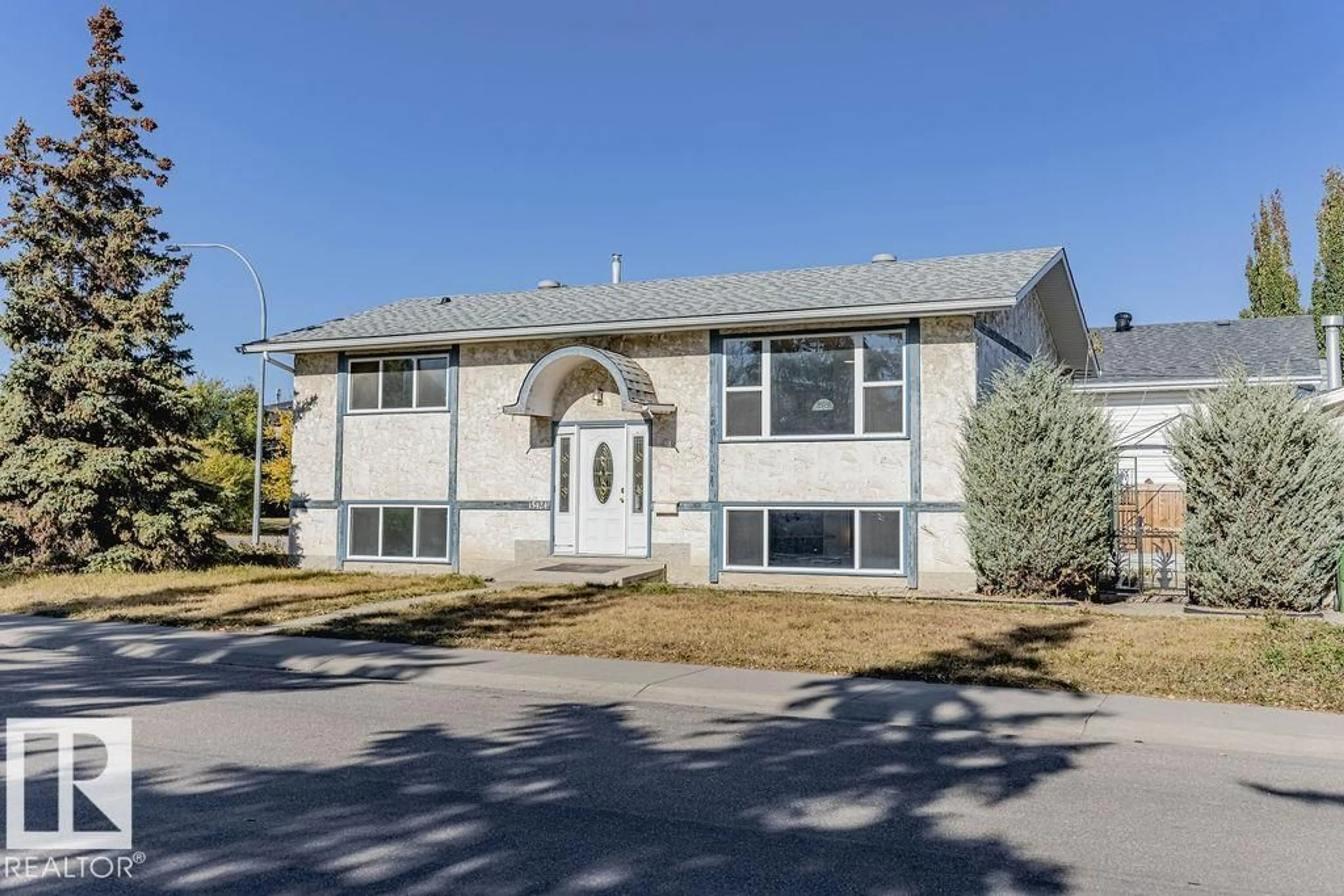 Home with vinyl exterior material, street for 15424 99 AV, Edmonton Alberta T5P4K5