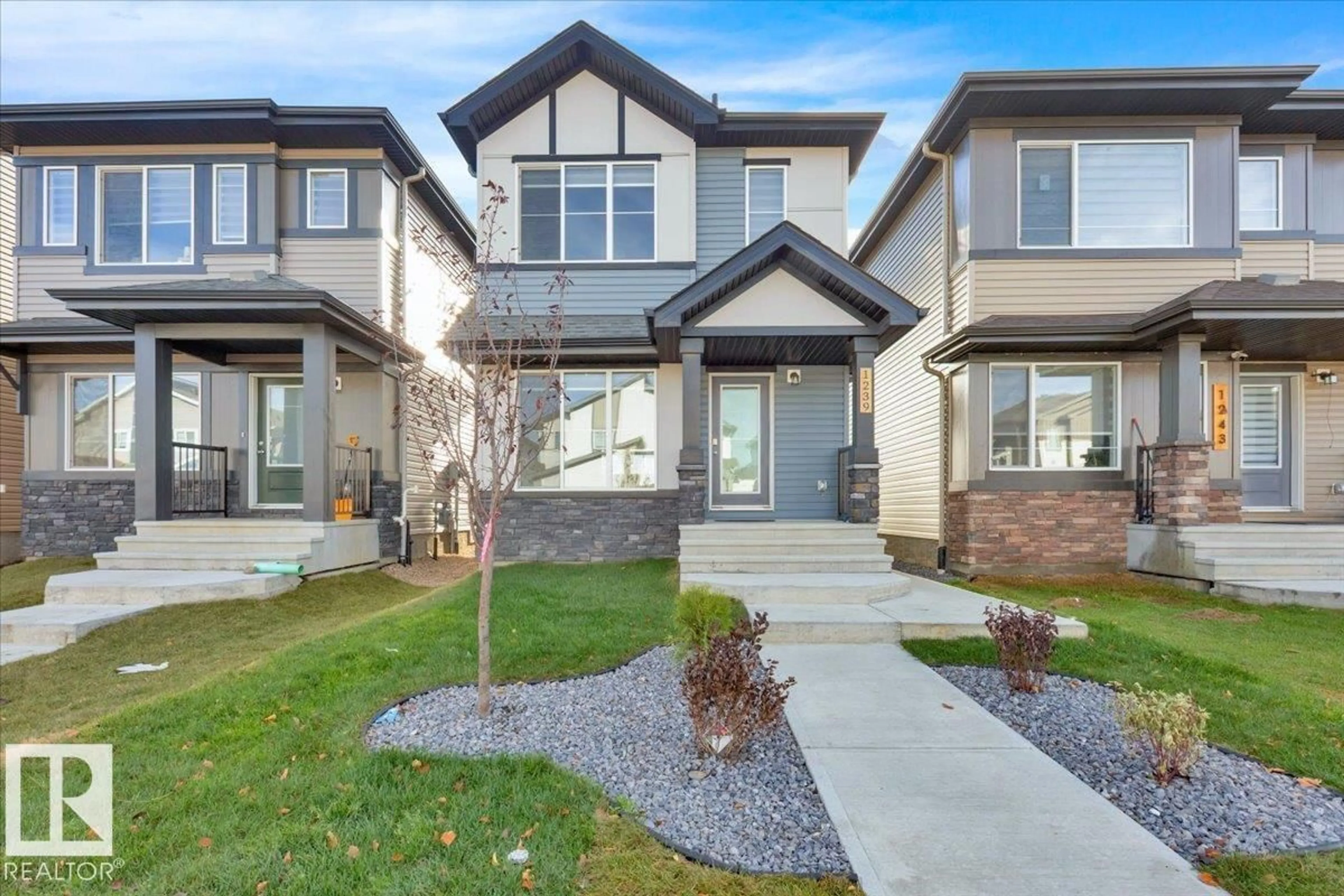 Home with brick exterior material, street for 1239 16 AV, Edmonton Alberta T6T0S9