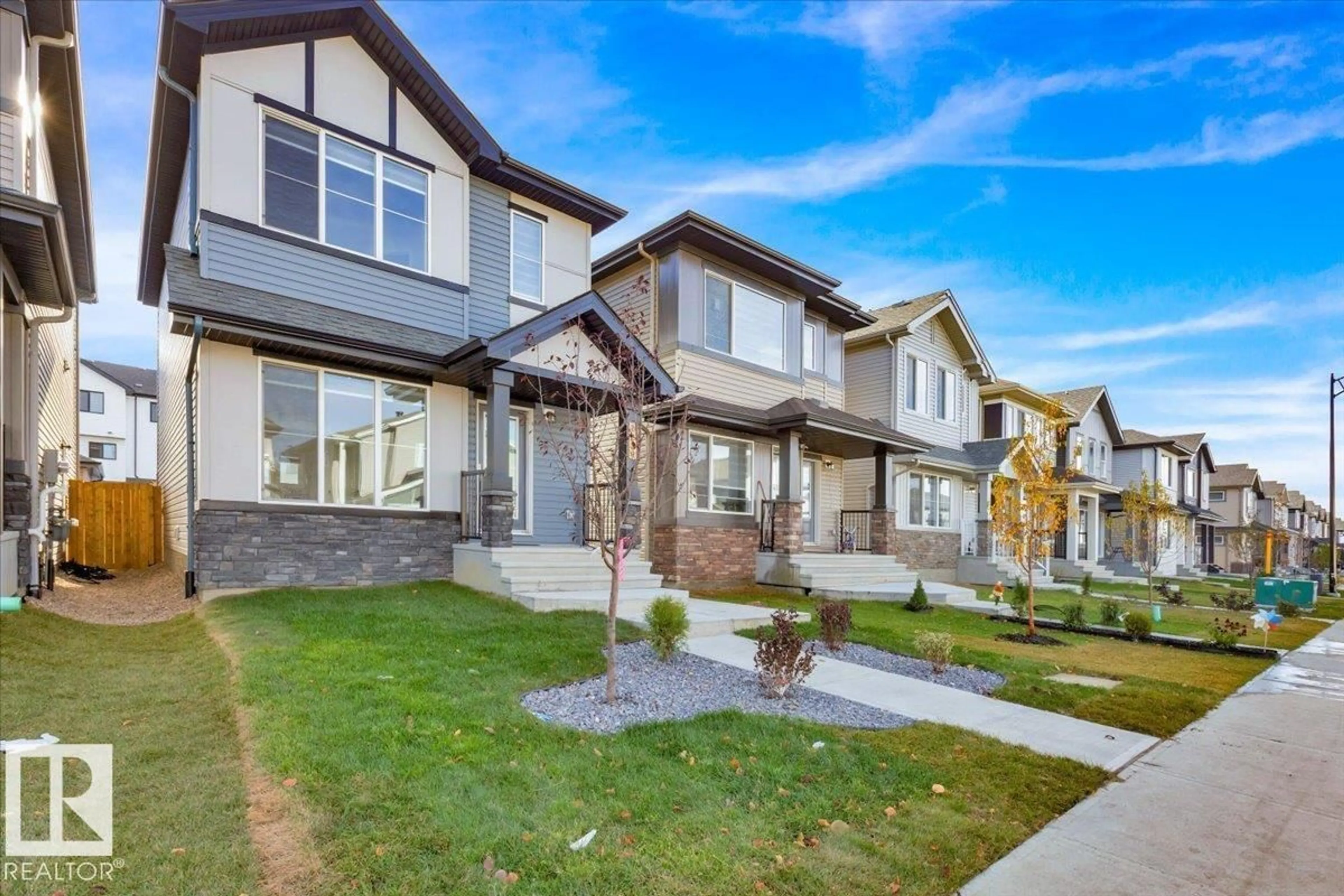 Home with vinyl exterior material, street for 1239 16 AV, Edmonton Alberta T6T0S9