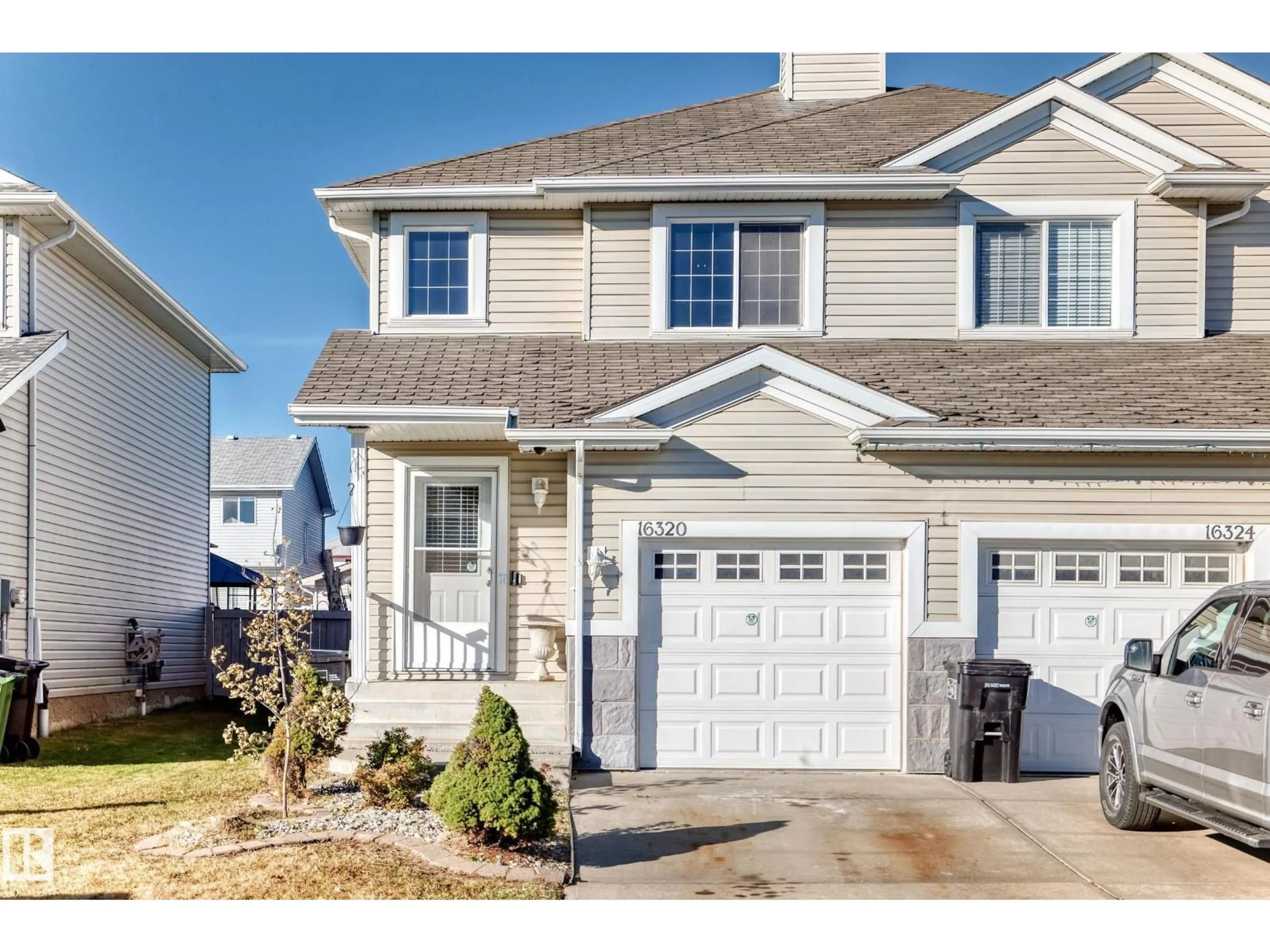 Home with vinyl exterior material, street for 16320 56 ST, Edmonton Alberta T5Y3L3