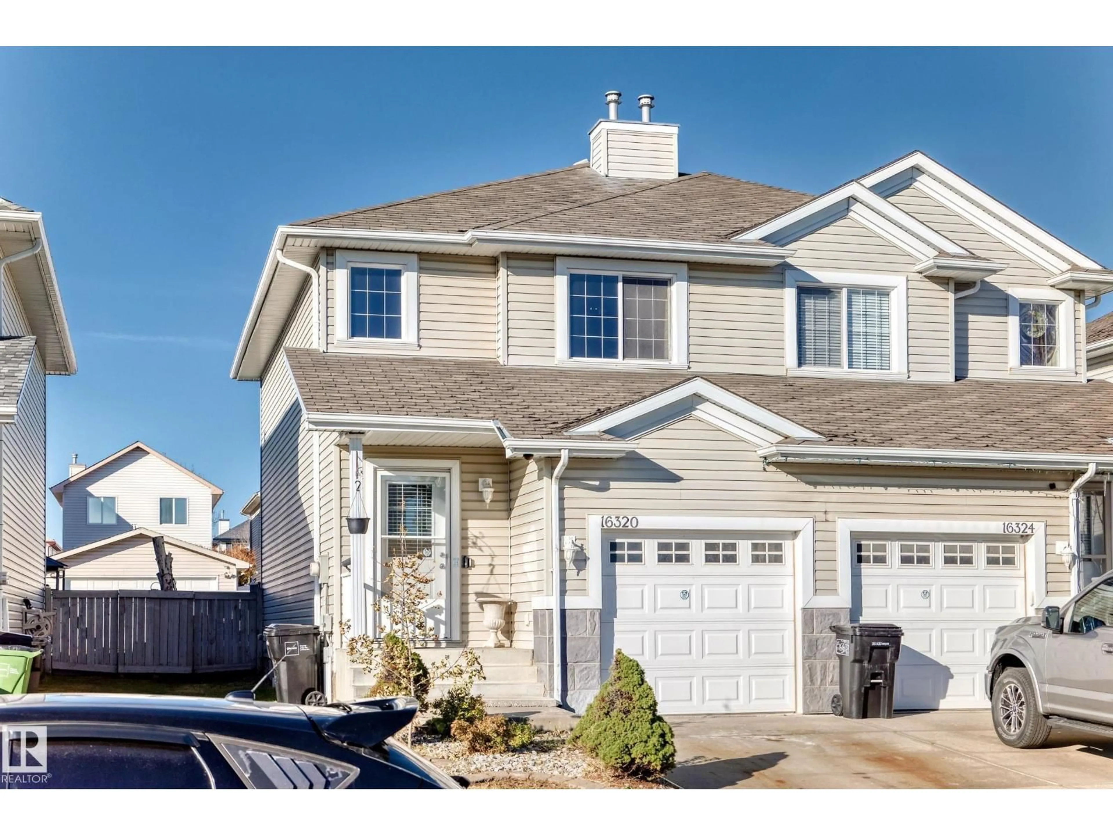Home with vinyl exterior material, street for 16320 56 ST, Edmonton Alberta T5Y3L3