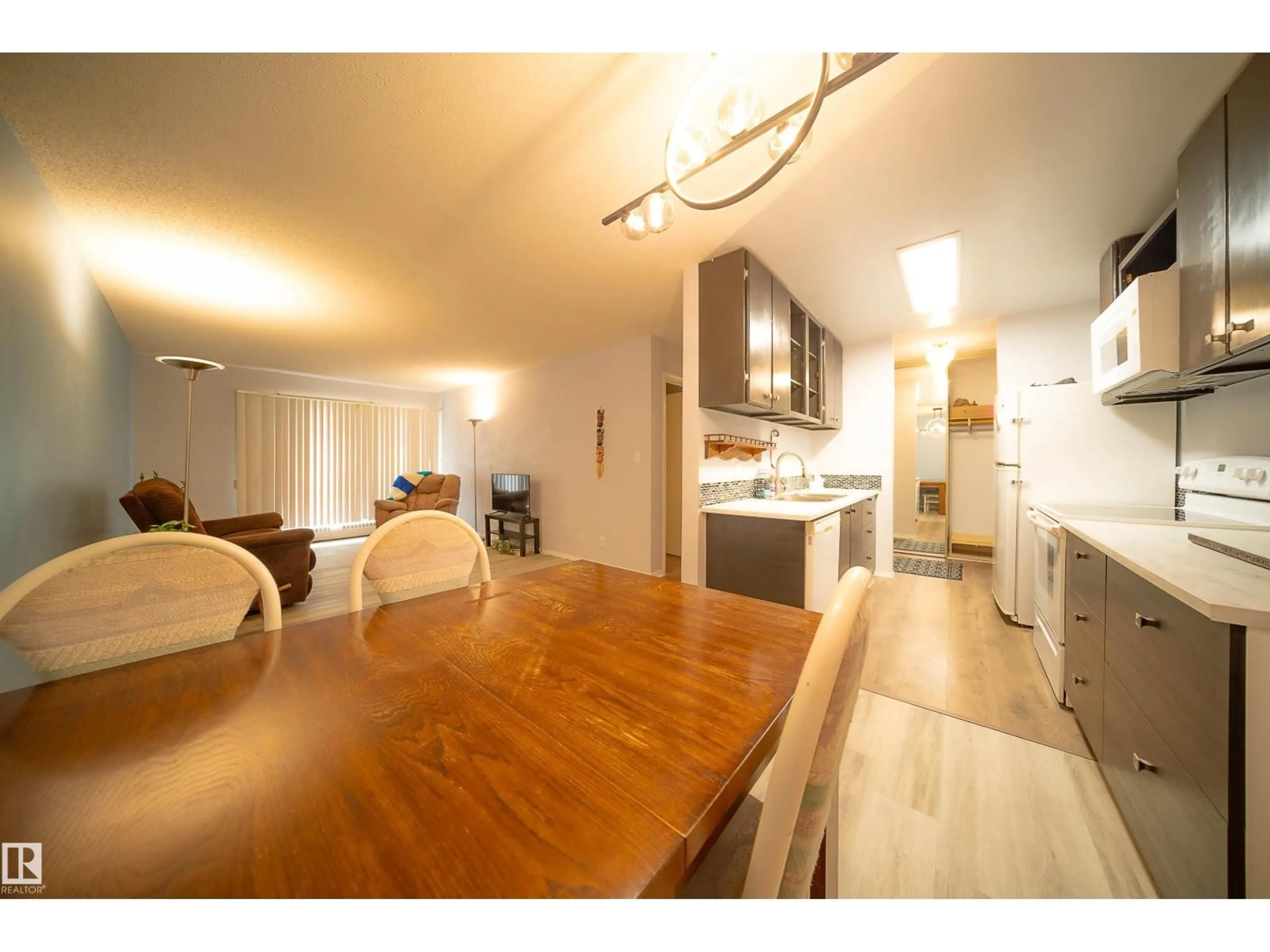Open concept kitchen, wood/laminate floor for 408 - 10511 19 AV, Edmonton Alberta T6J5S8