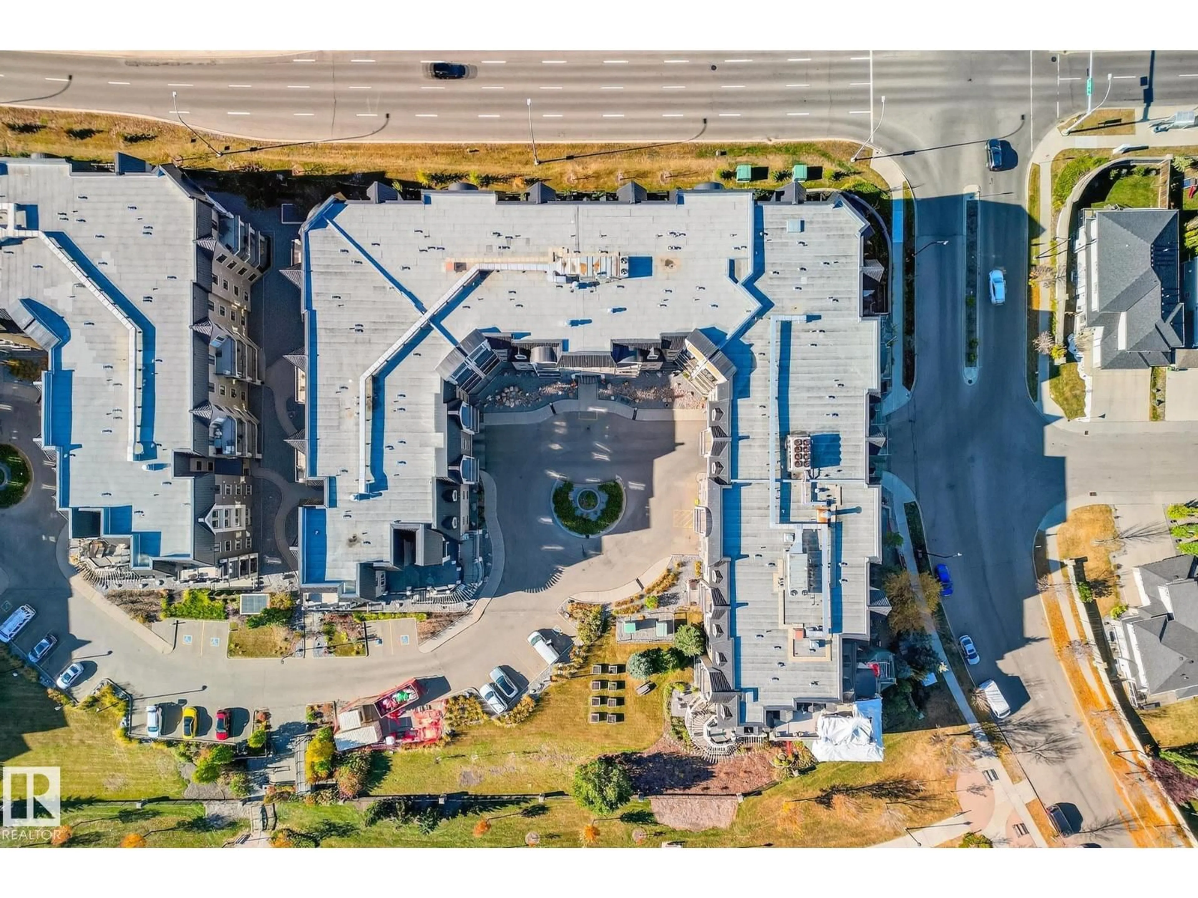 A pic from outside/outdoor area/front of a property/back of a property/a pic from drone, building for 6083 - 418 MAYNARD WY, Edmonton Alberta T6R0R5