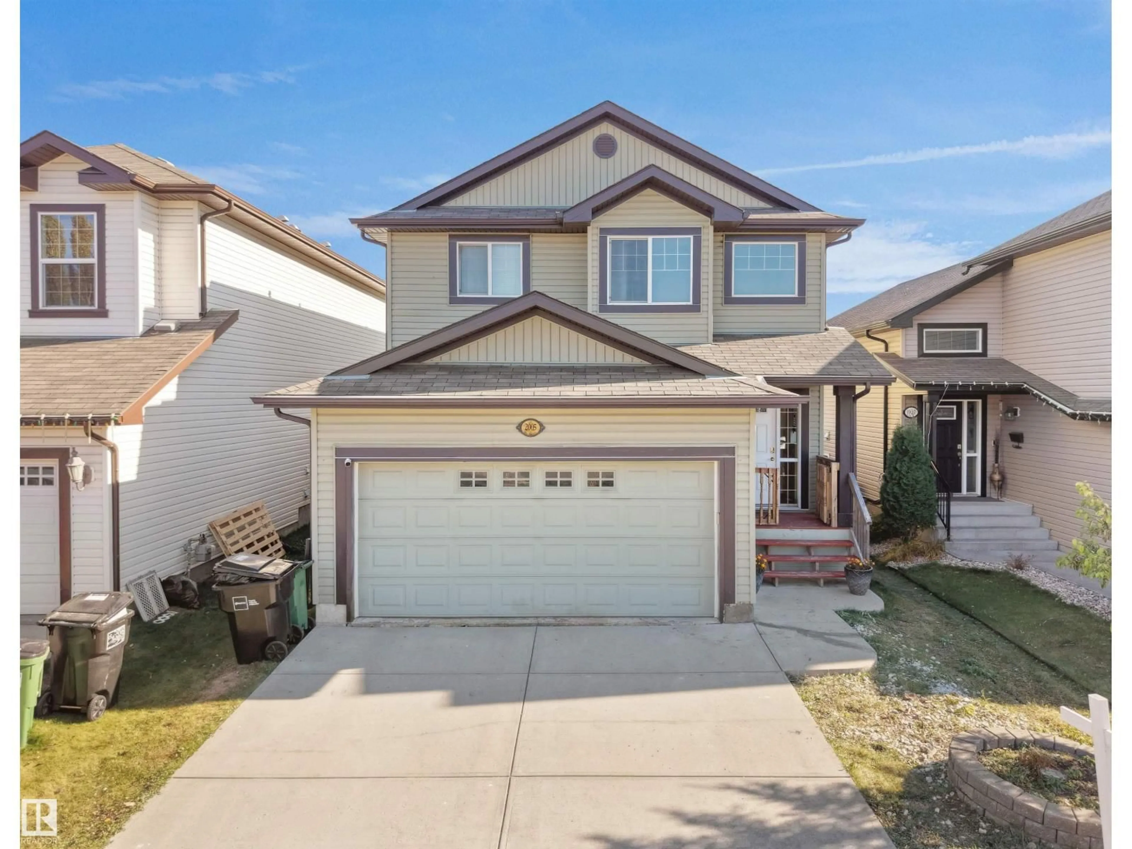 Home with vinyl exterior material, street for NW - 2005 32A ST, Edmonton Alberta T6T0L6