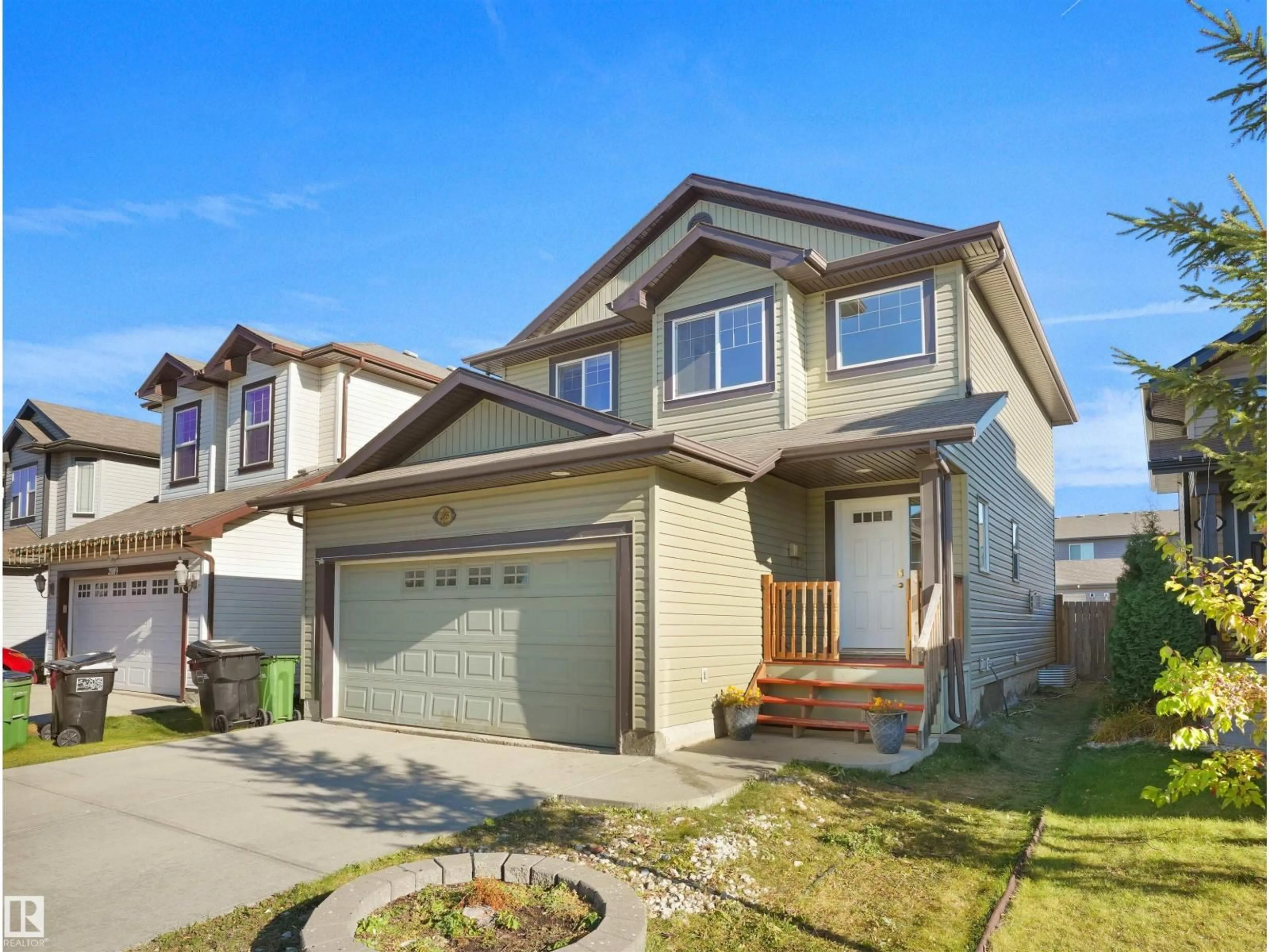 Home with vinyl exterior material, street for NW - 2005 32A ST, Edmonton Alberta T6T0L6
