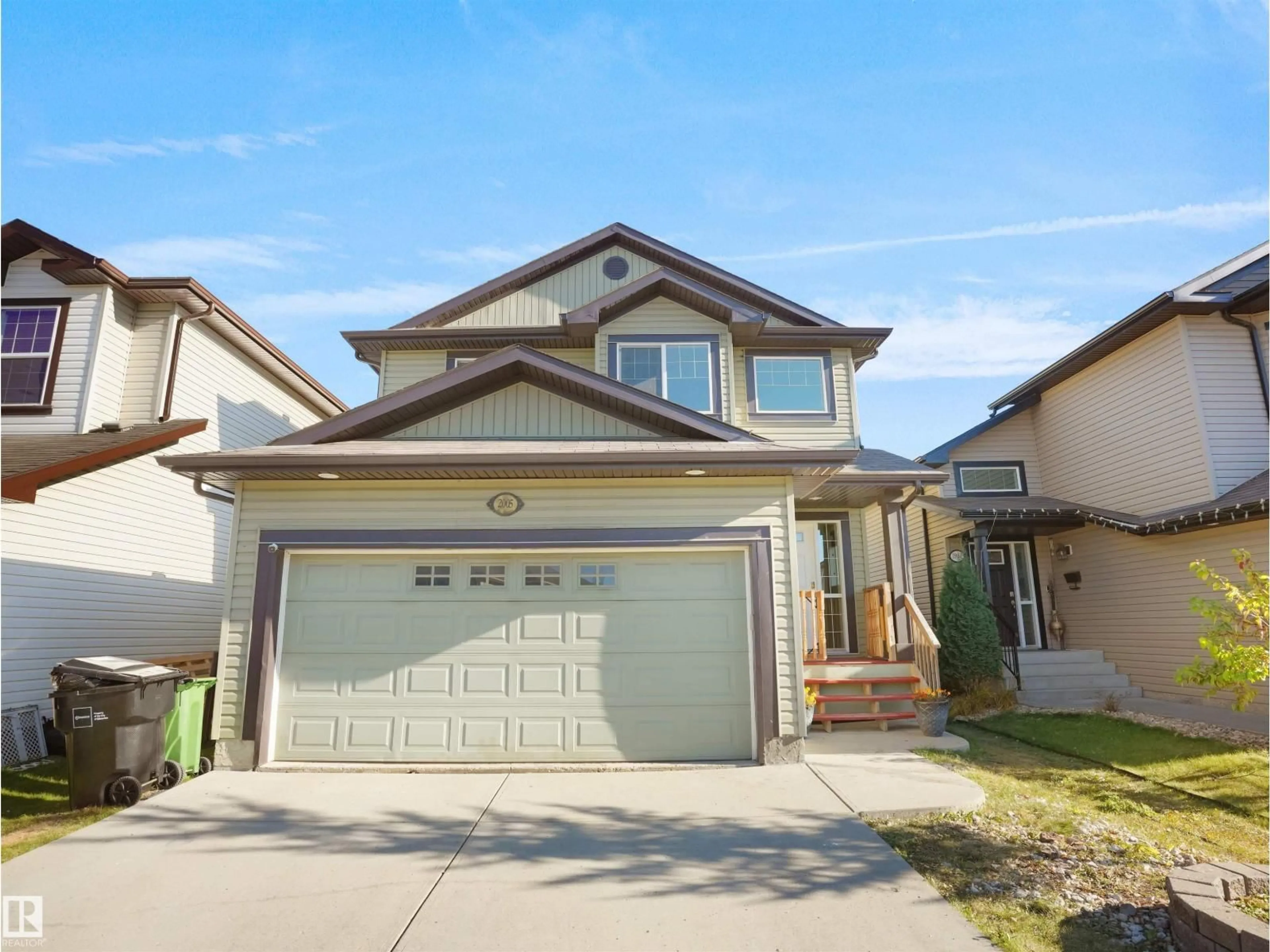 Home with vinyl exterior material, street for NW - 2005 32A ST, Edmonton Alberta T6T0L6